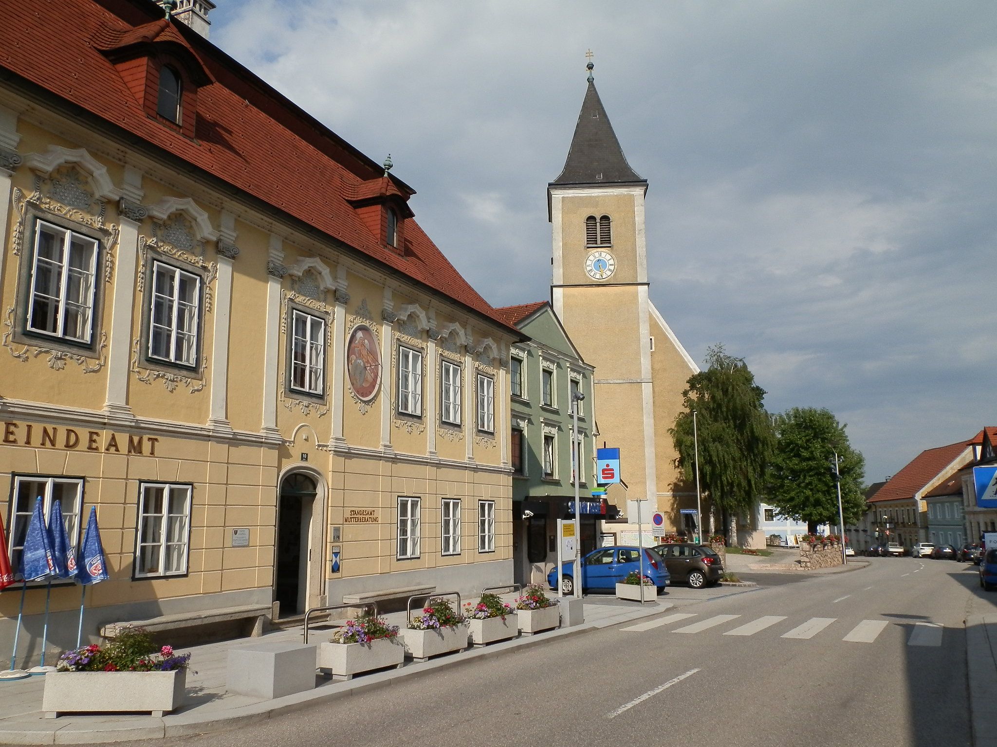 Street in Strengberg with municipal office and church.