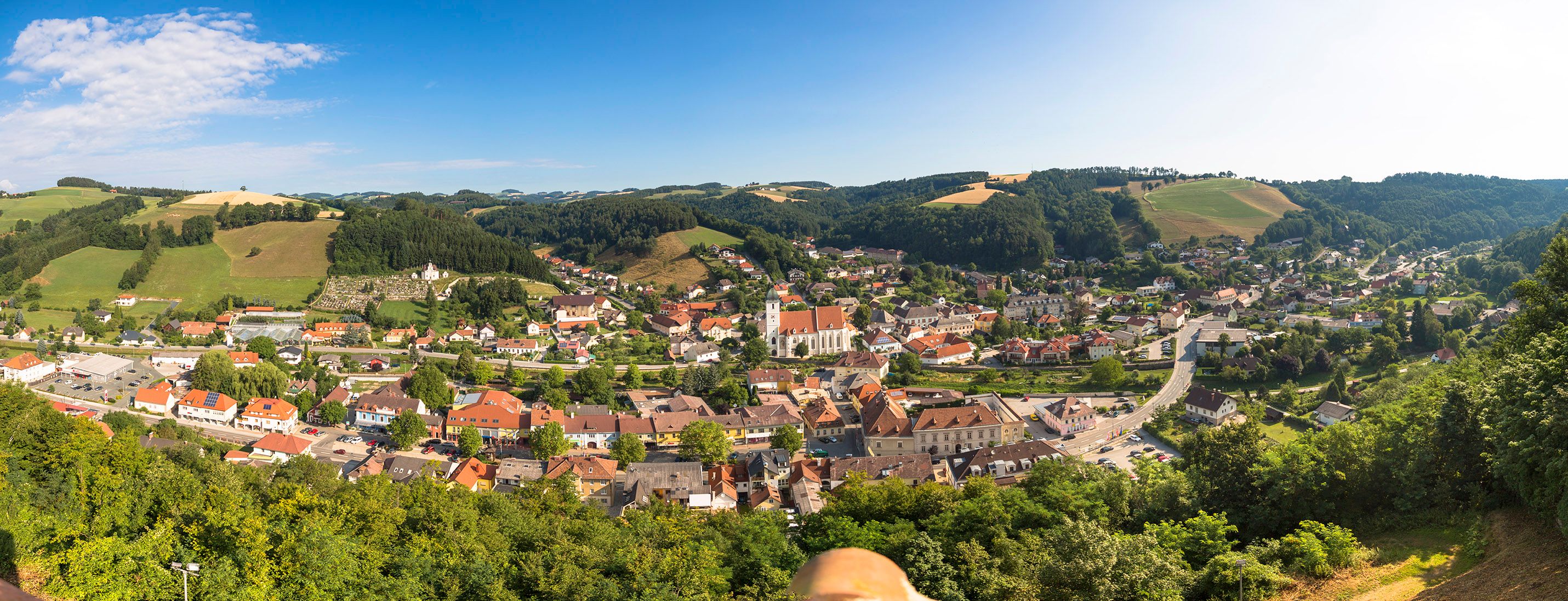 Panoramic view of Kirchschlag in the Bucklige Welt, surrounded by hills and forests.