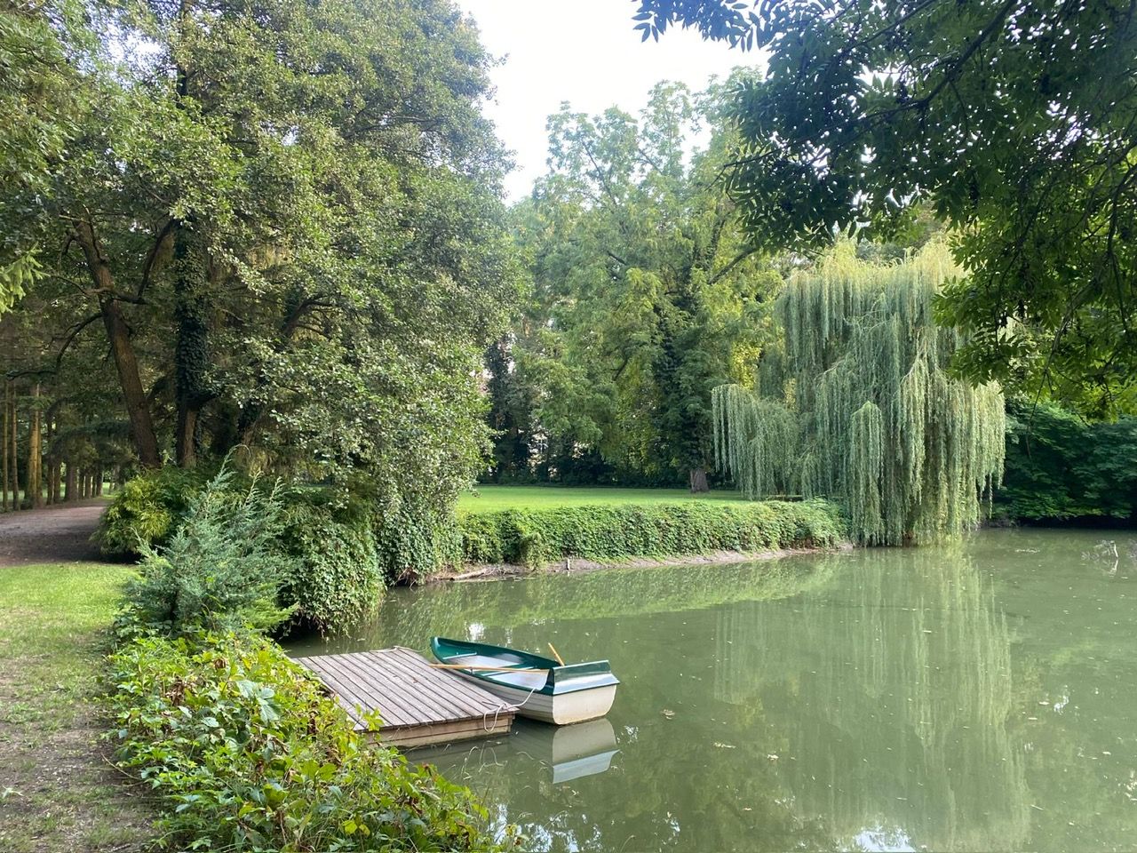 Garden pond with boat and jetty
