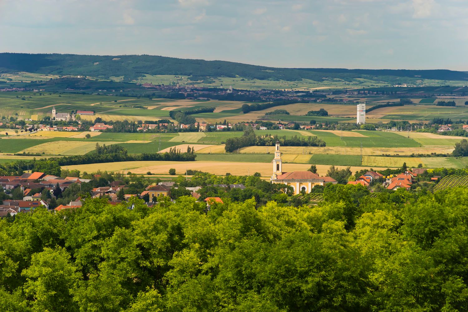 Landscape view of Zellerndorf with church and fields.
