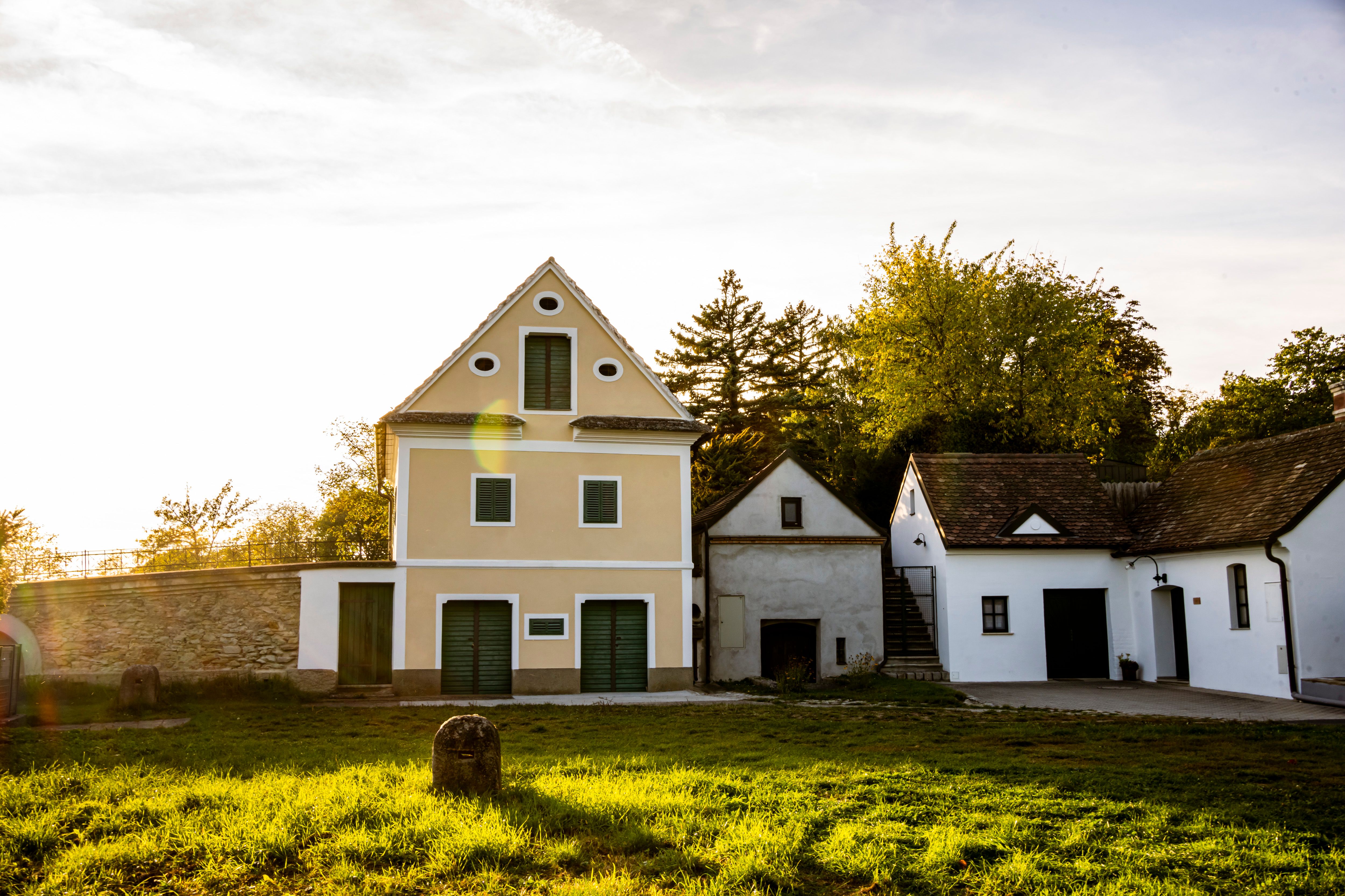Traditional buildings in the Sitzendorf wine cellar lane at sunset.