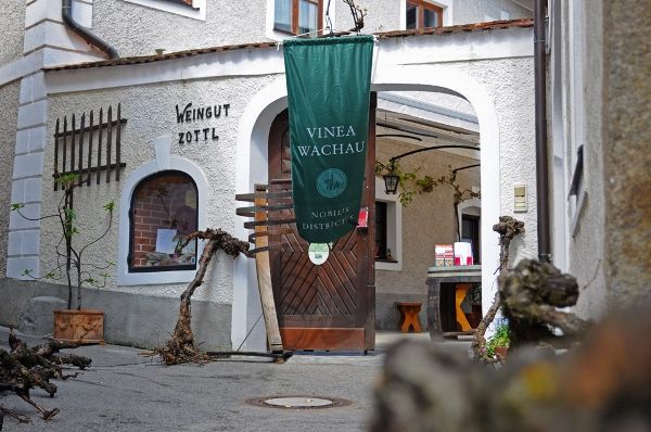 Entrance to a winery with sign 'Vinea Wachau' and 'Weingut Zottl'.