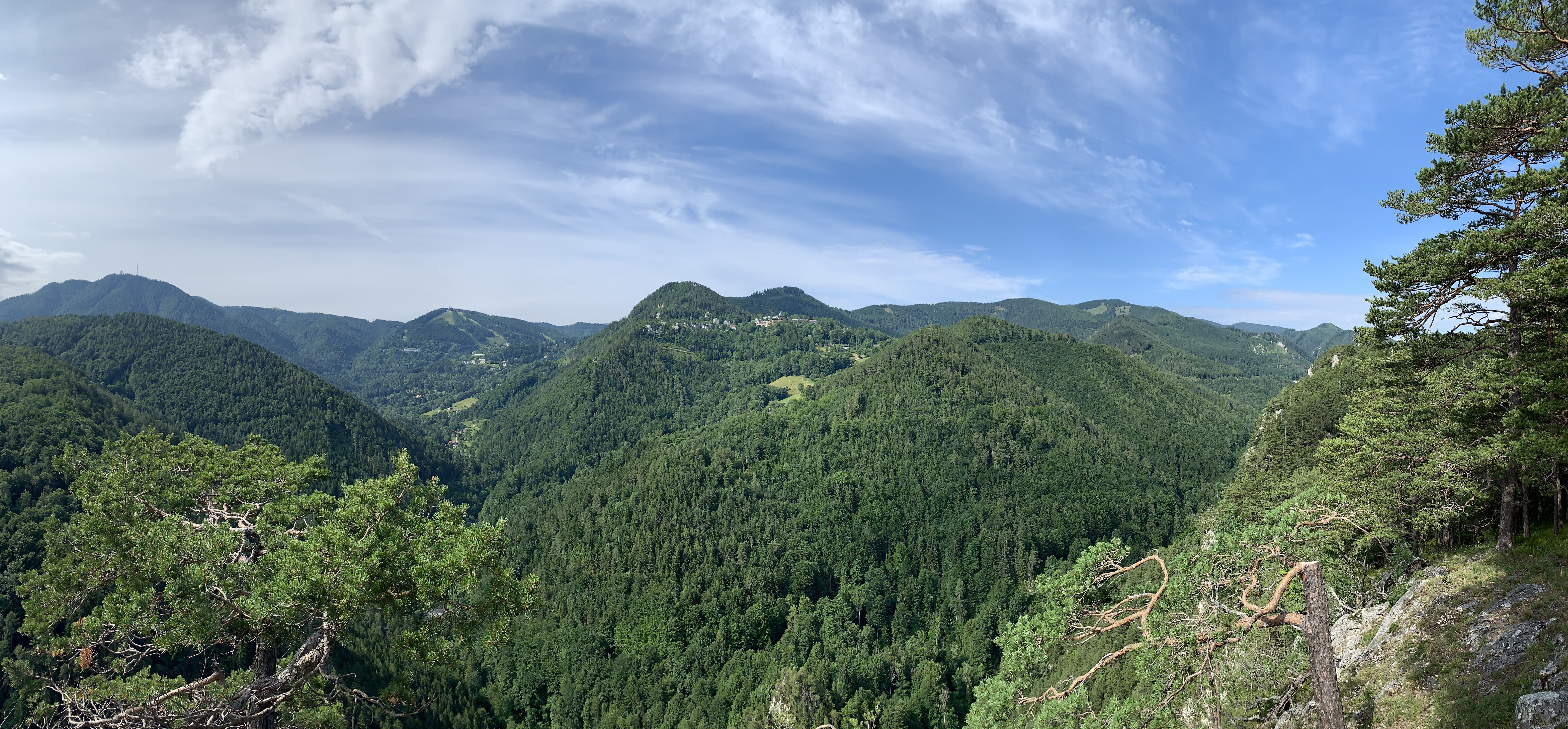 Panoramic view of wooded hills and blue skies towards Semmering