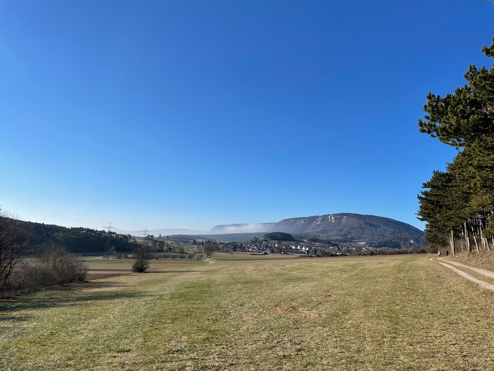 Landscape with meadow, hills and clear sky.