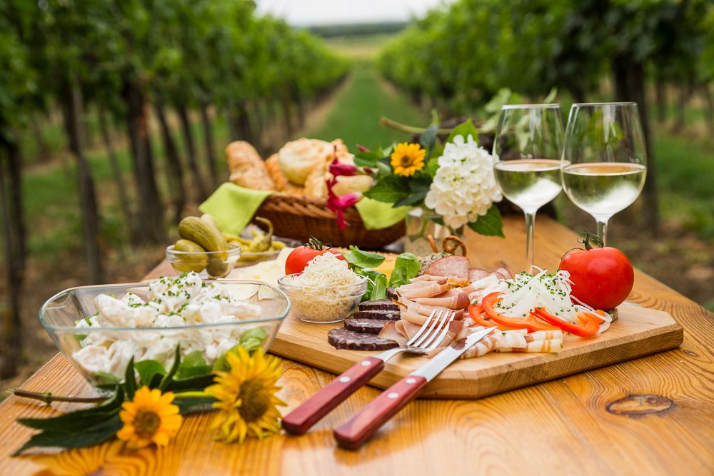 Heurigen snack on a wooden table in the vineyard.