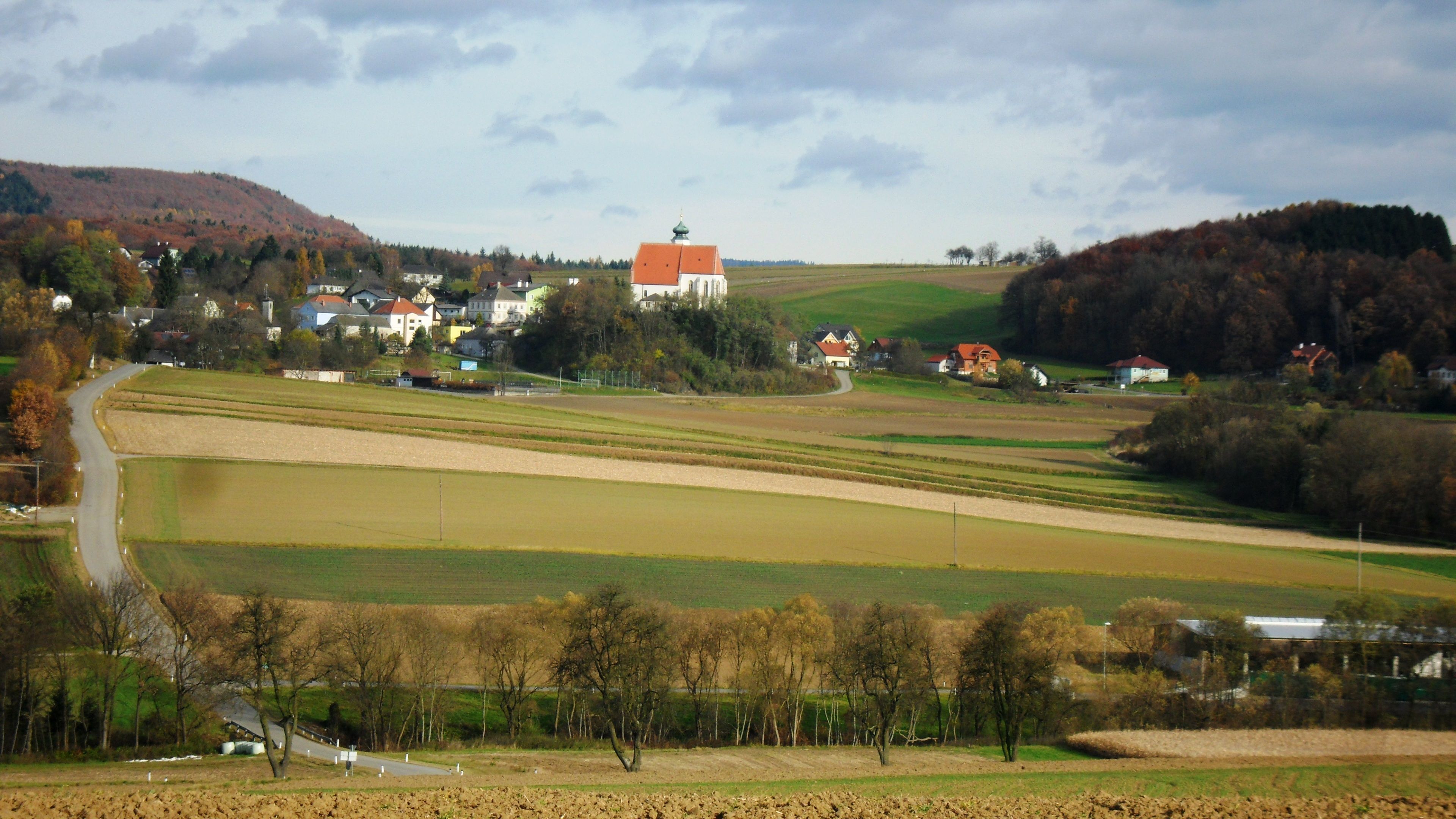 Landscape with church and fields in Gerolding, Austria.