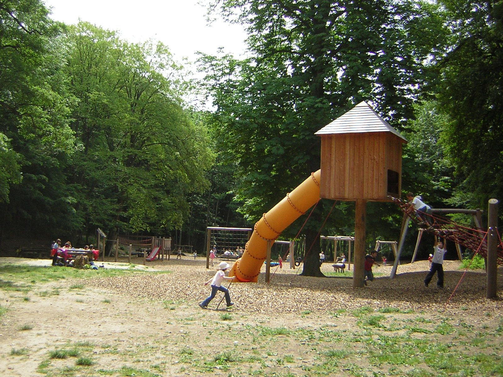 Playground in Sparbach Nature Park with slide and climbing frame.