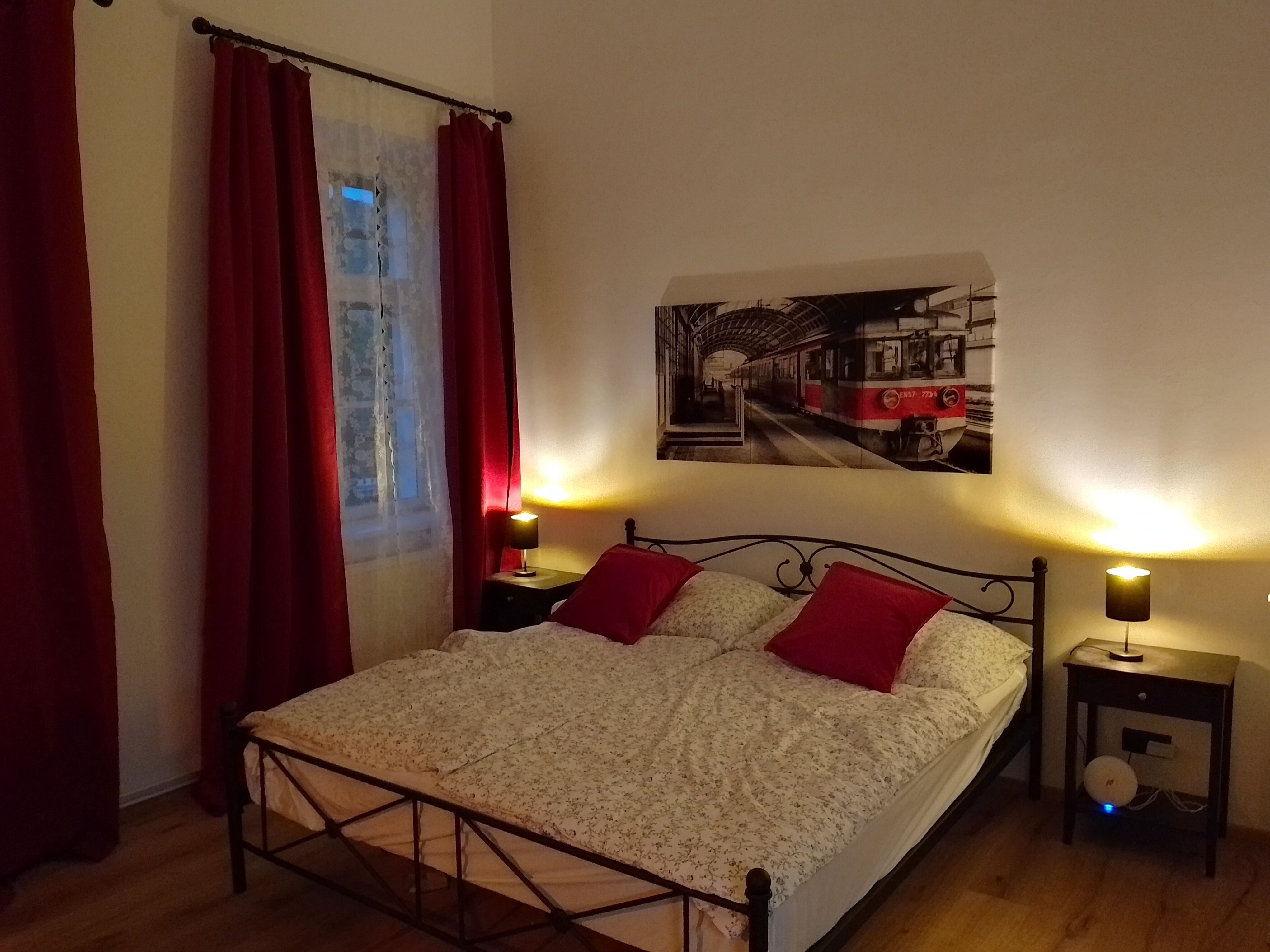 Cozy bedroom with railroad decor.