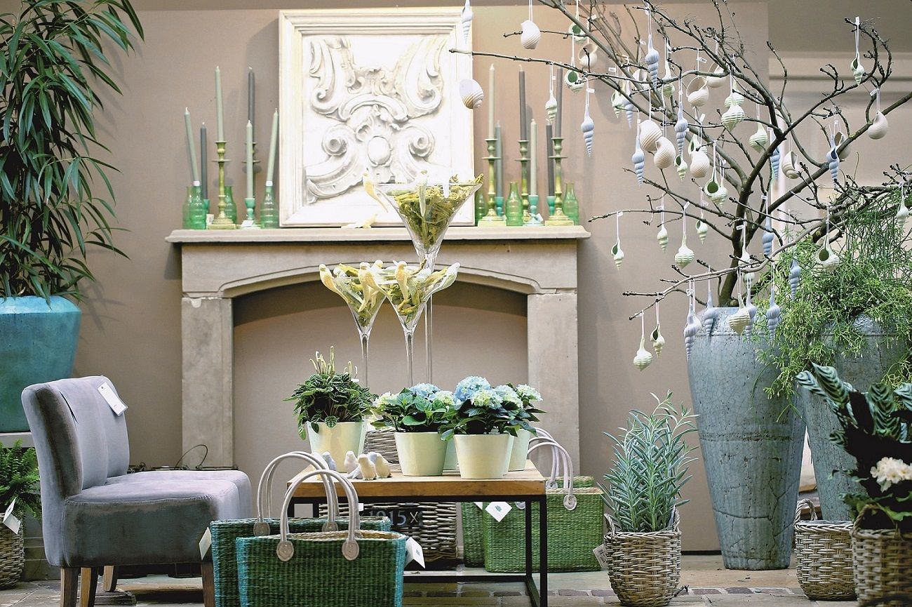 Elegant interior design with plants, vases and decorations.