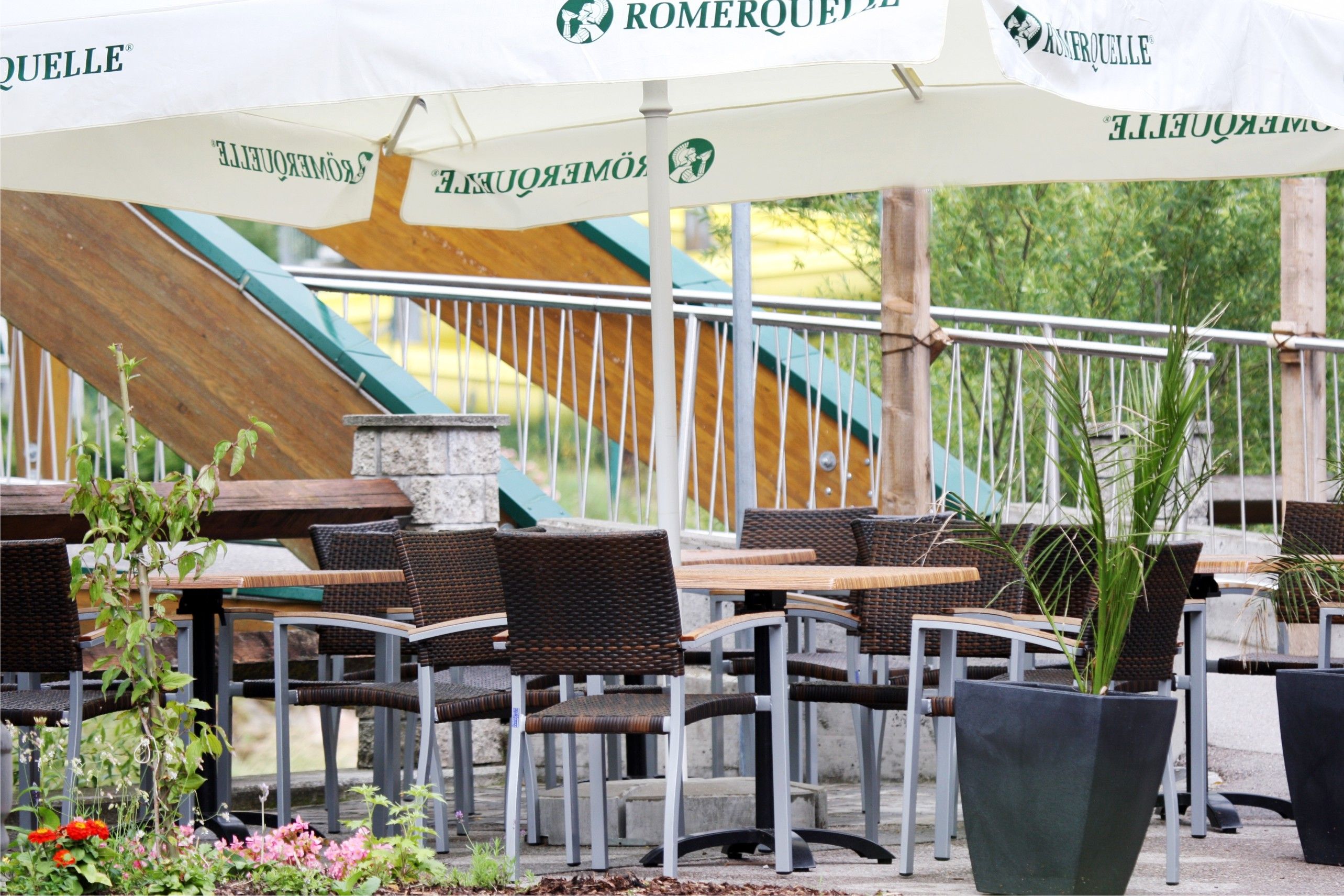 Comfortable terrace with tables, chairs and parasols.