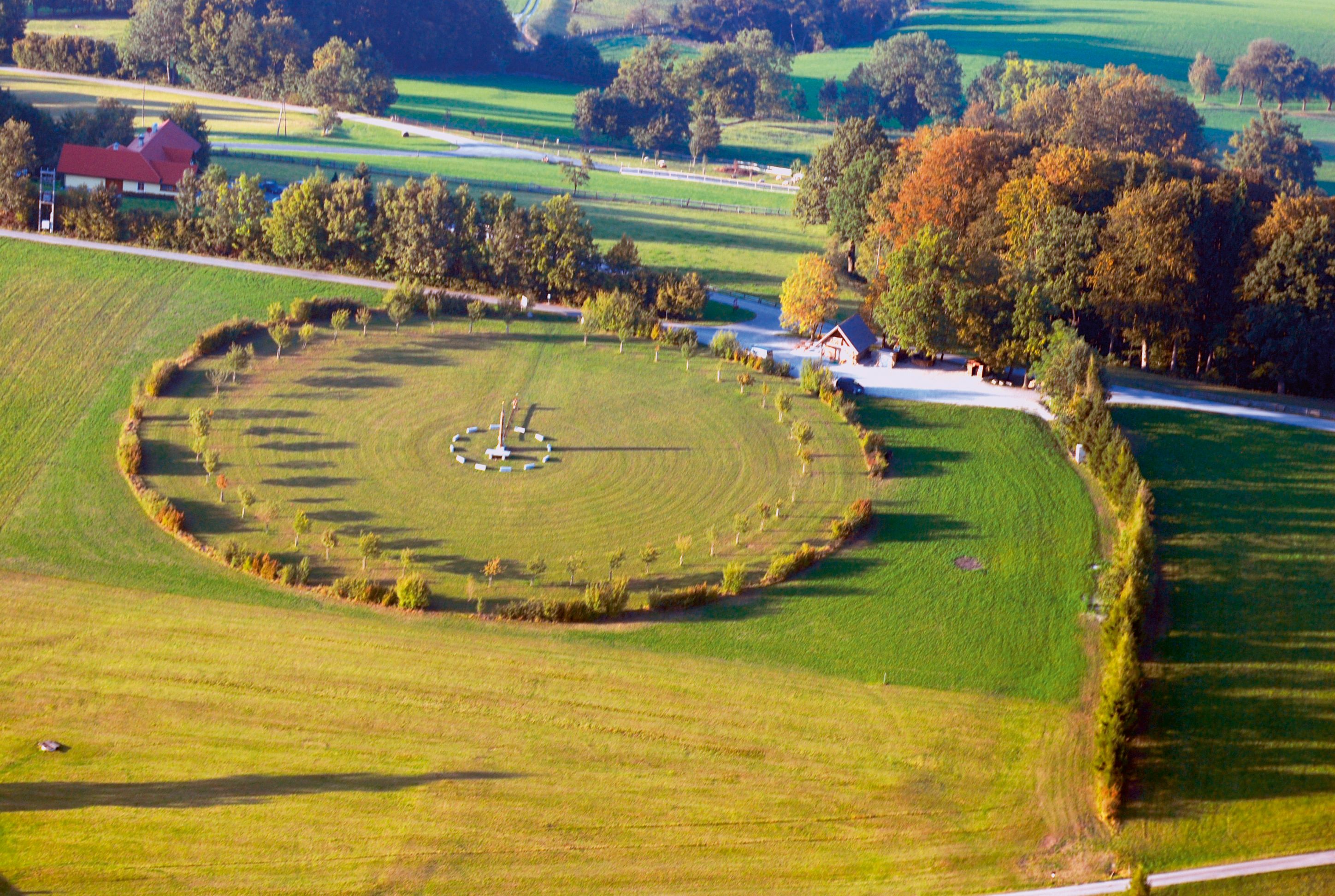 Aerial view of the solstice circle in Steinakirchen, surrounded by trees and meadows.
