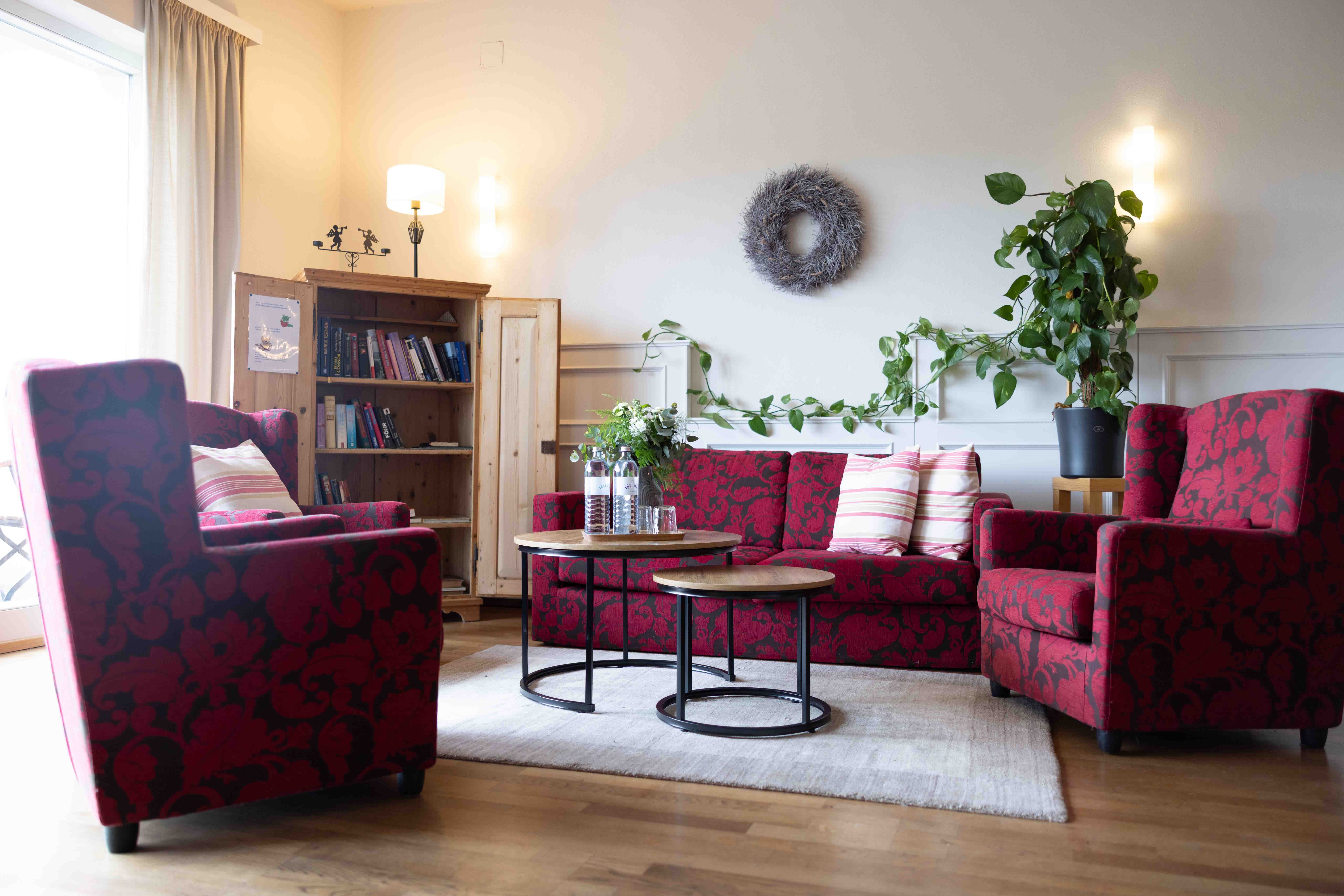 Lounge area with red sofa furniture and coffee table 