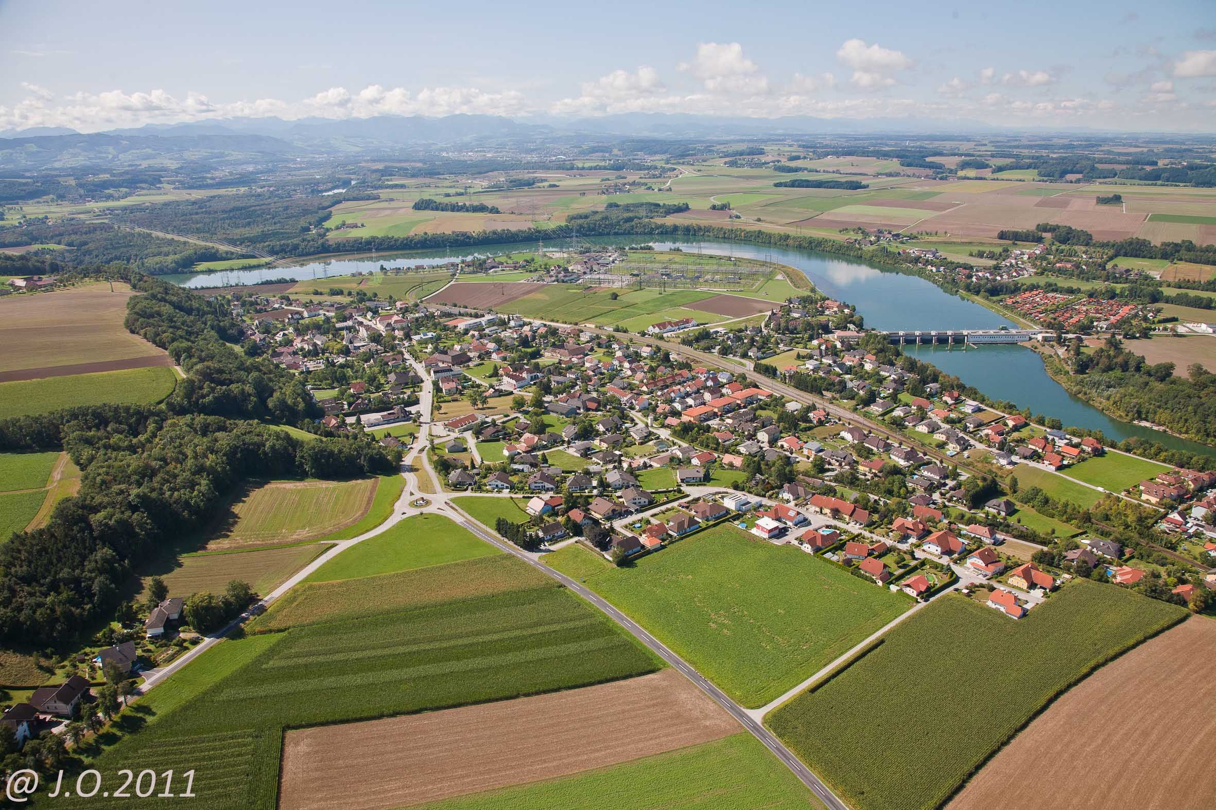 Aerial view of Ernsthofen with river and bridge.