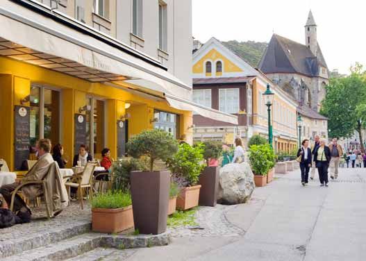 Street scene with café and church in the background.