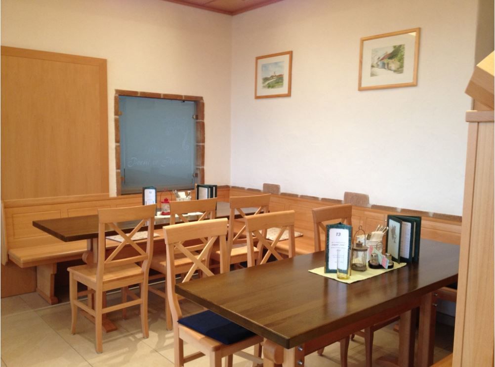 Interior wine tavern wooden tables with armchairs