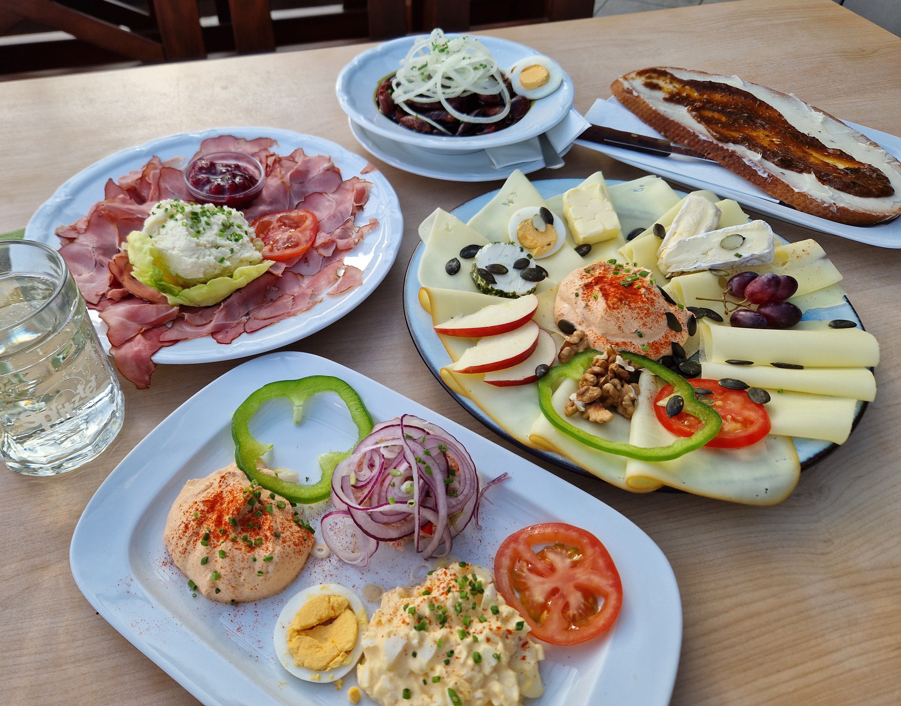 Various Austrian Heurigenjause dishes on one table.