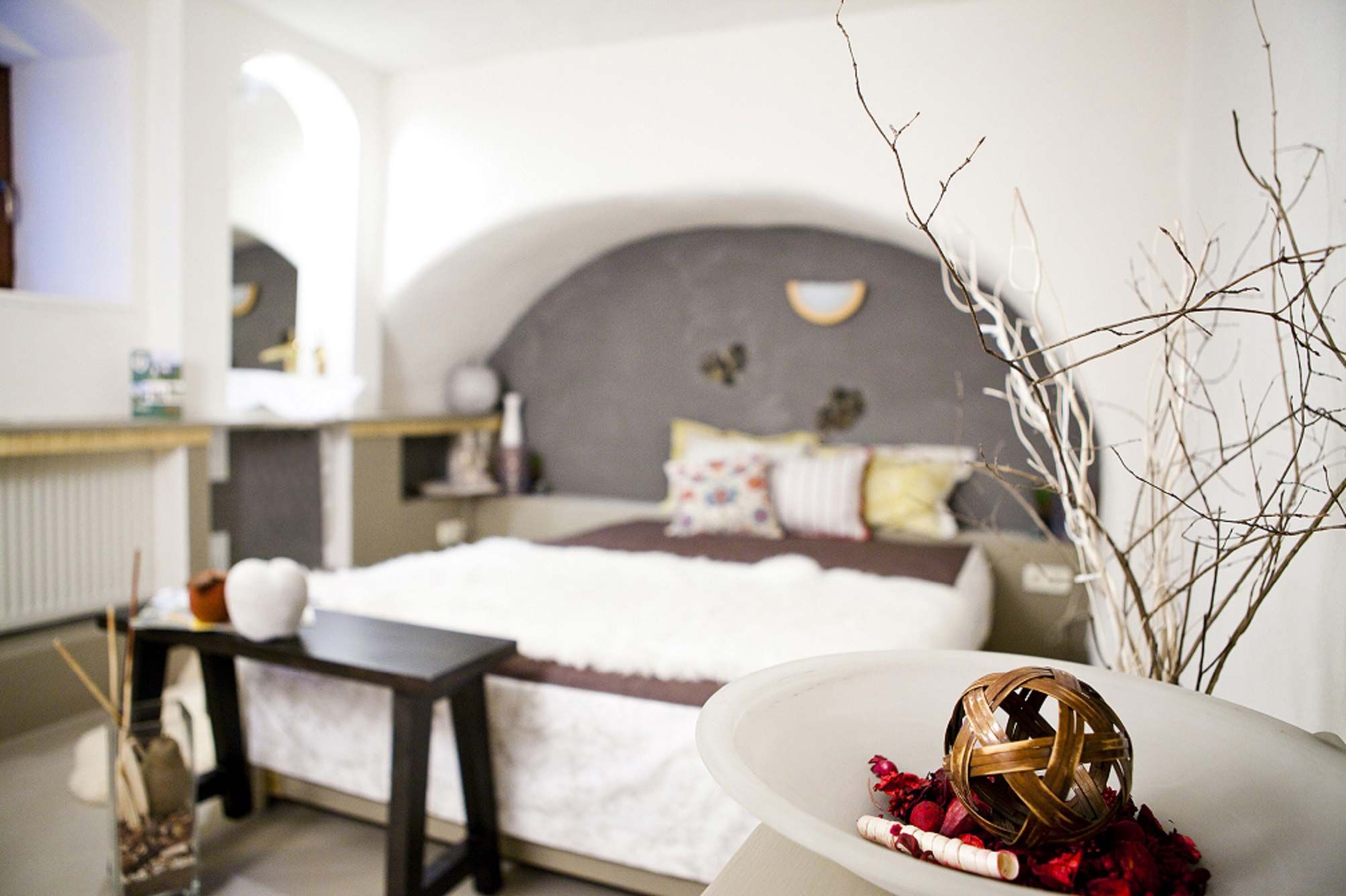 Cozy bedroom with decoration and bed.