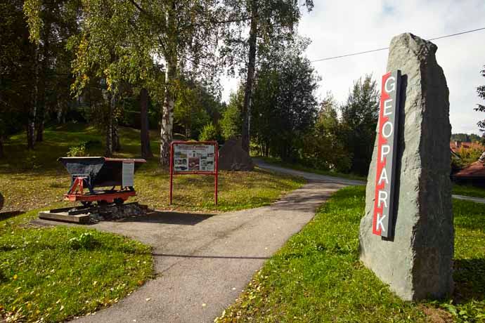 Entrance to the Aspang Geopark with signpost and information board.