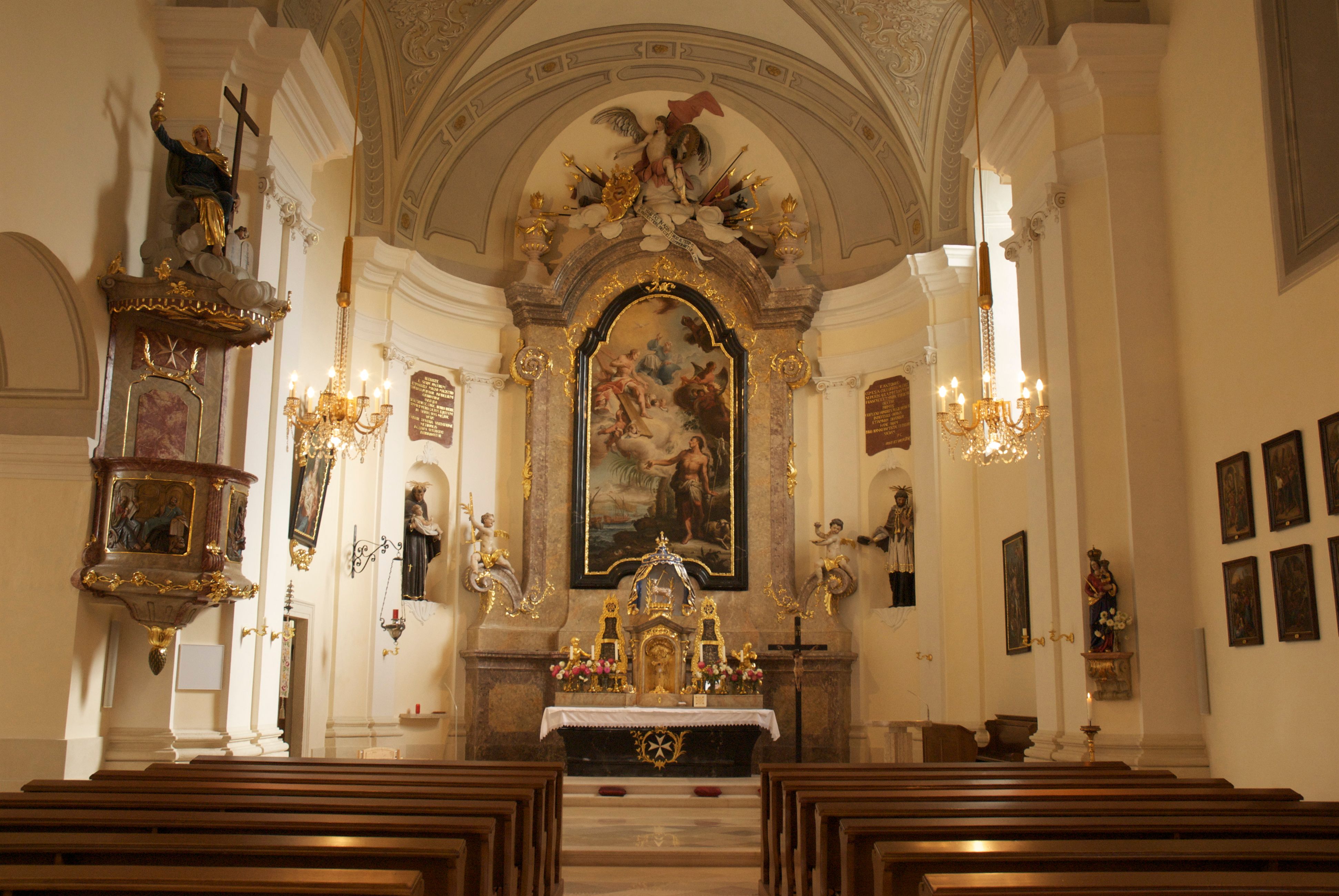 Interior view of Mailberg Castle church with altar and ornate decorations.