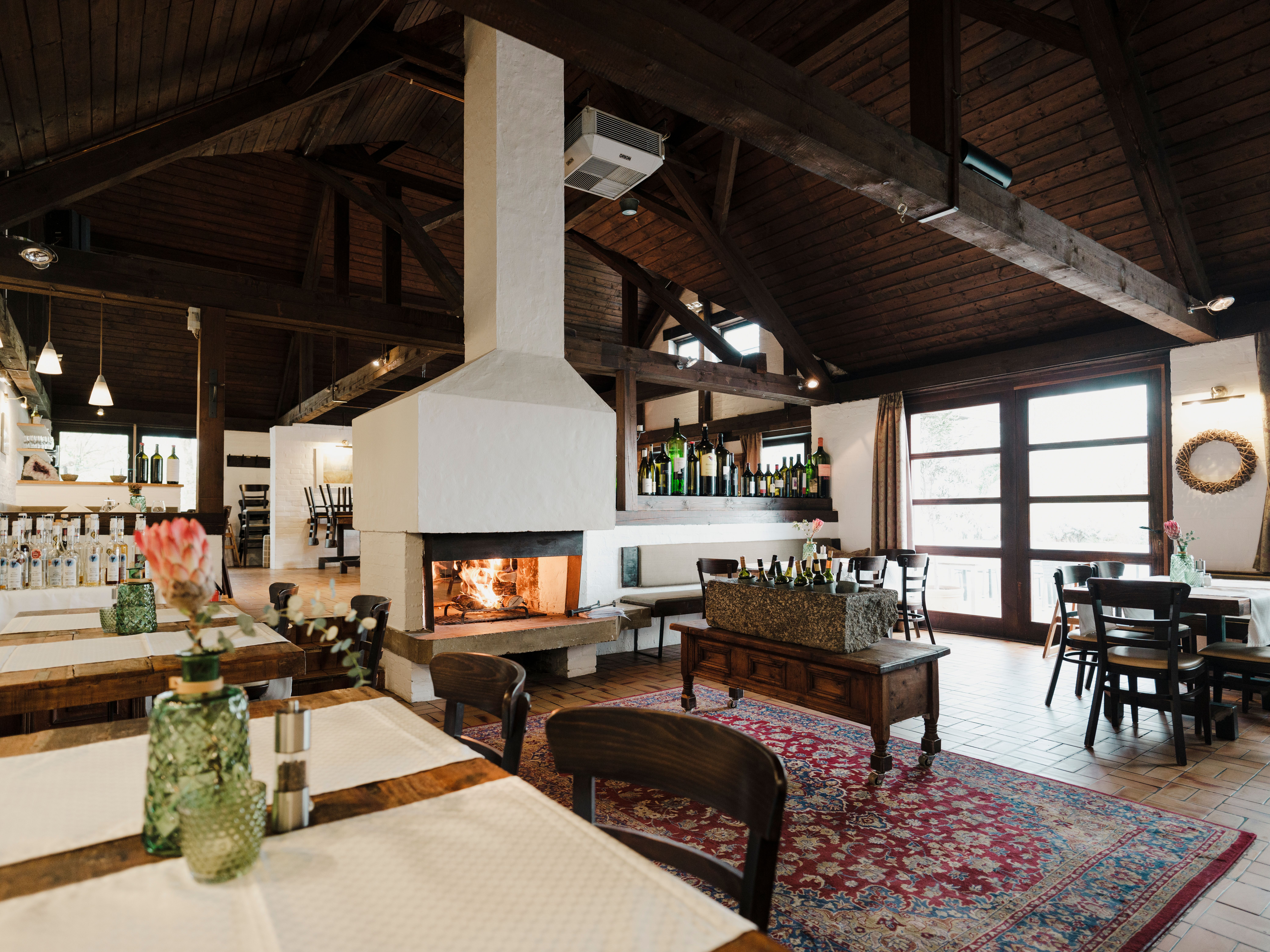 Gourmet dish with salmon, herbs and flowers served on a slate plate.