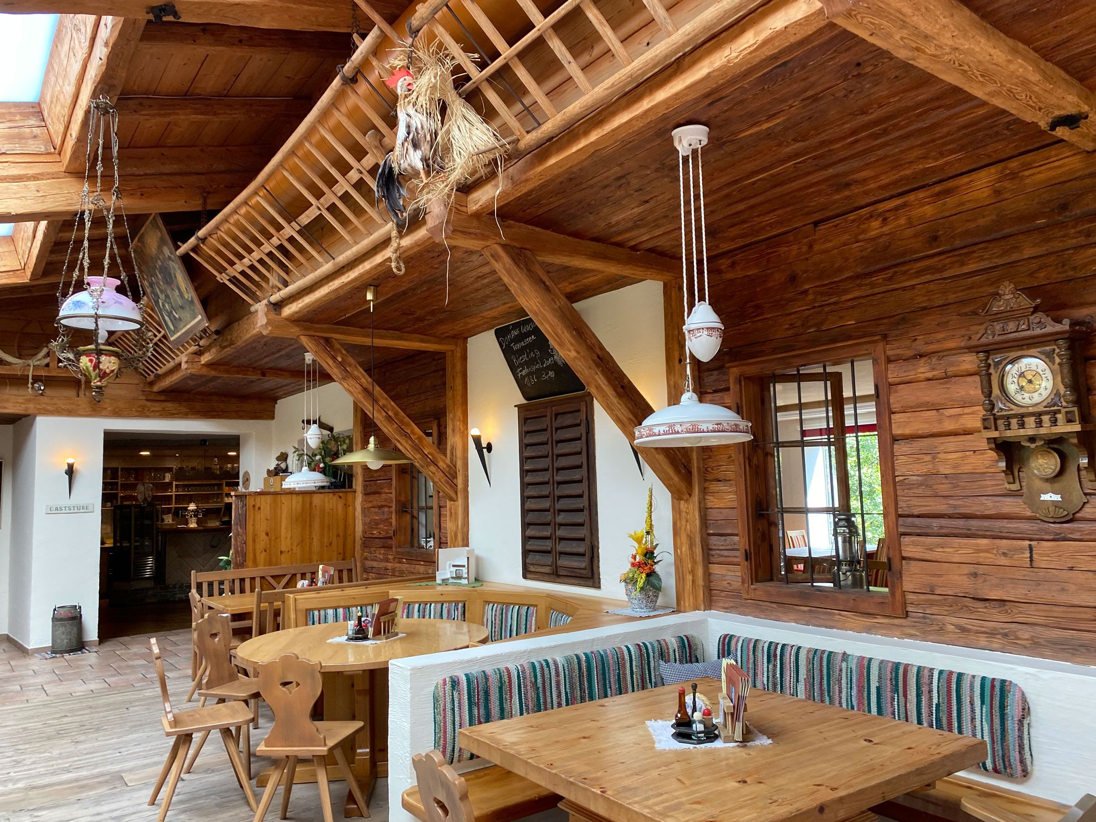 Rustic restaurant with wooden furniture and decorations.
