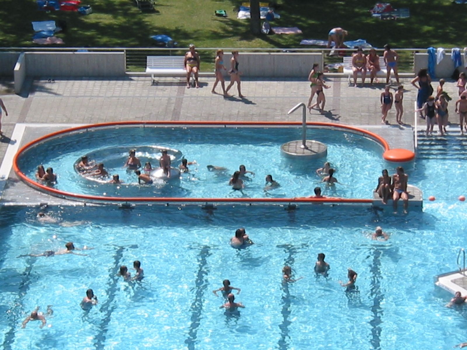 People swim and relax in a whirlpool at the Stockerau recreation center.
