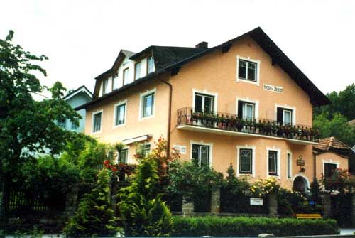 Orange bunkhouse with wooden balcony