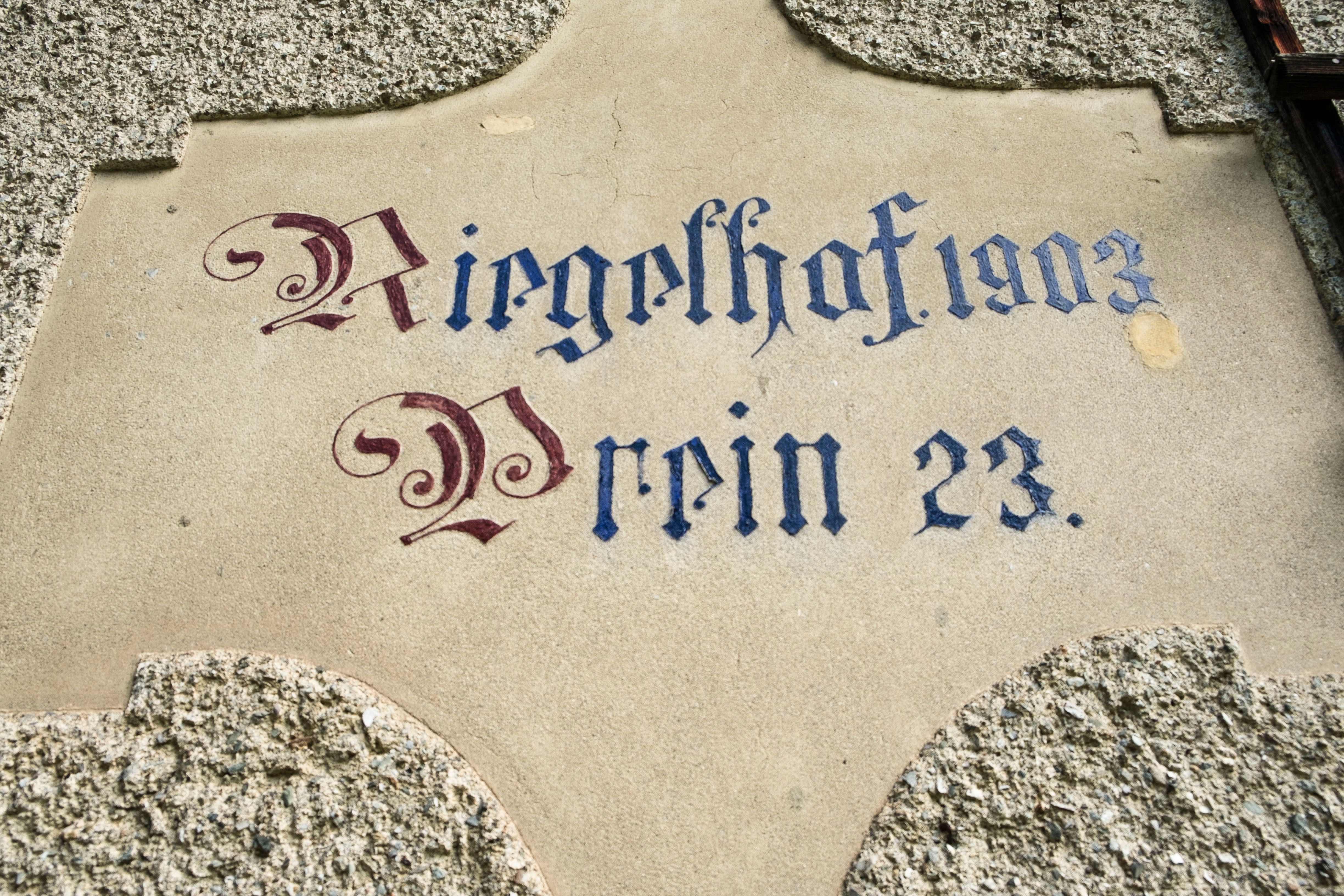Inscription 'Riegelhof 1903 Prein 23' on a wall.