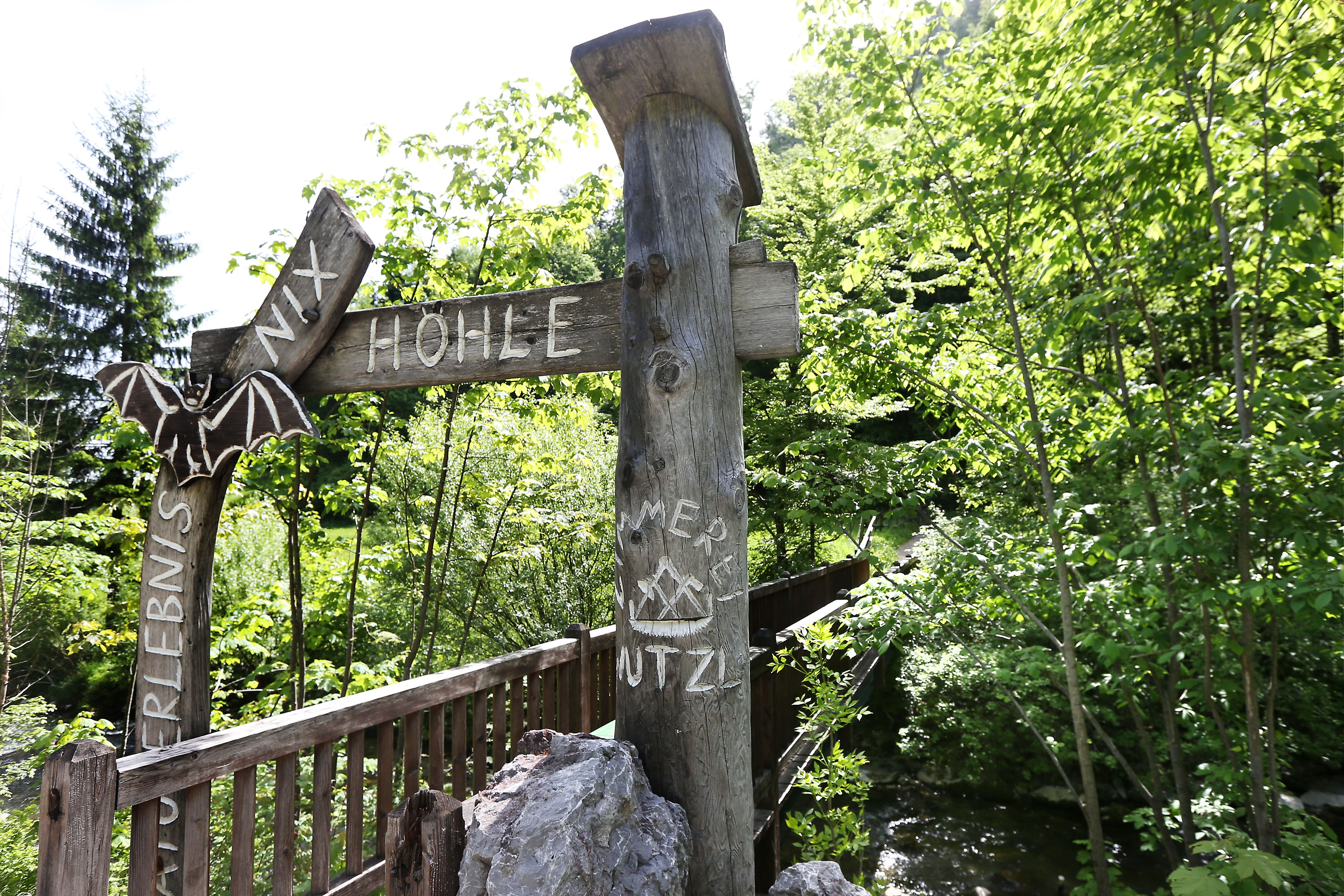 Entrance to the Nix Cave near Frankenfels with wooden sign and bat decoration.