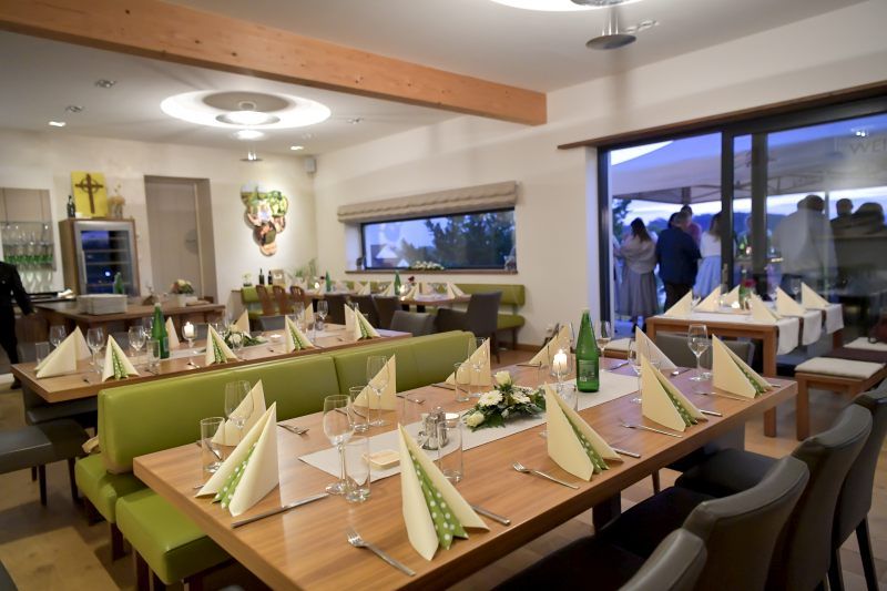 Elegant tasting room with laid tables and decoration.