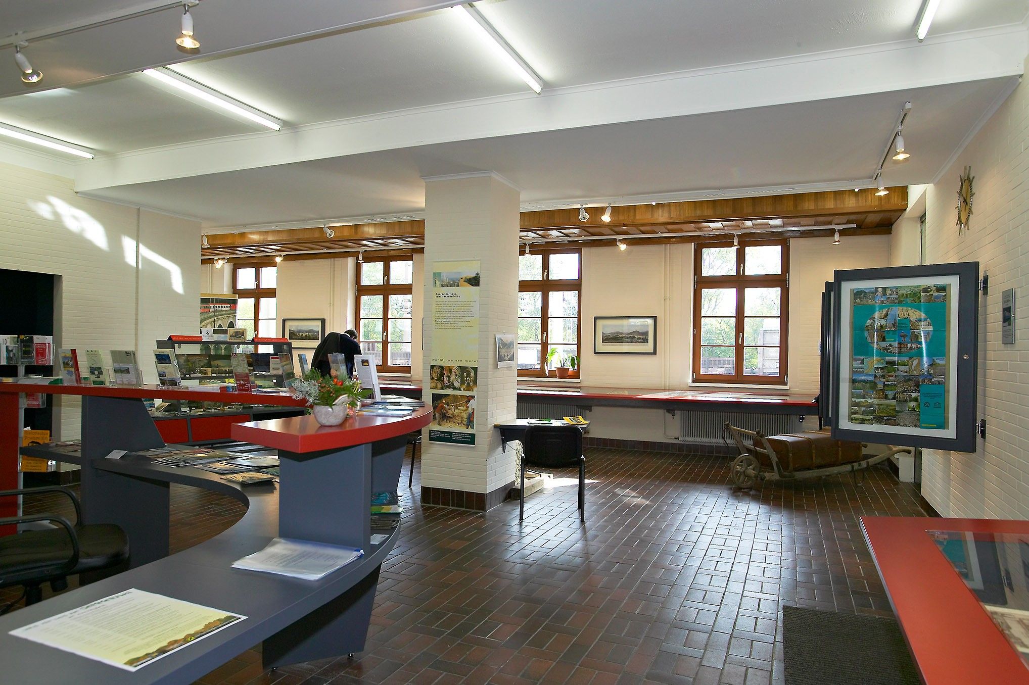Interior view of a museum with exhibits and information material.