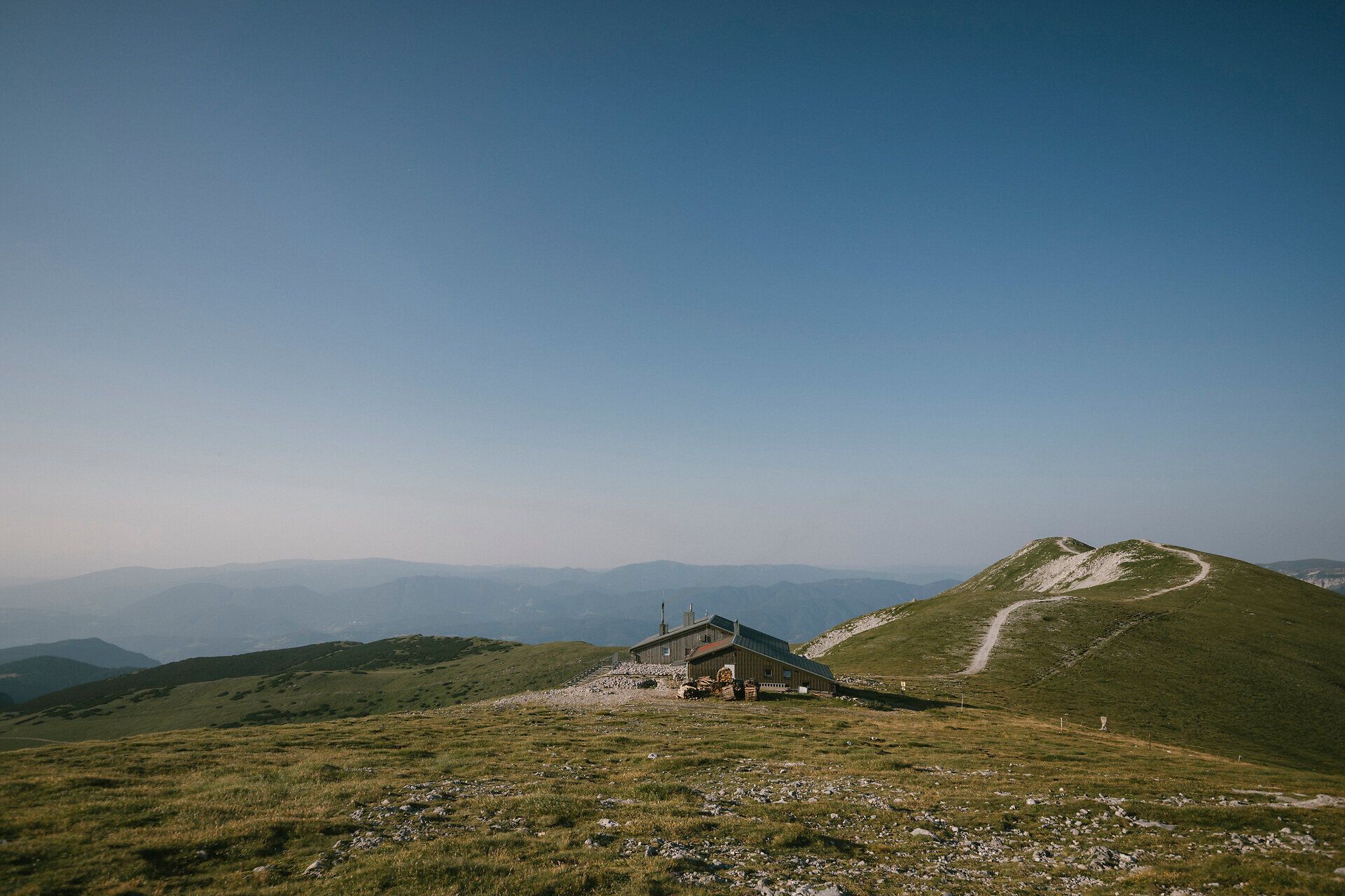 A fisherman's cabin on the Schneeberg, nestled amid the vast alpine mountain landscape