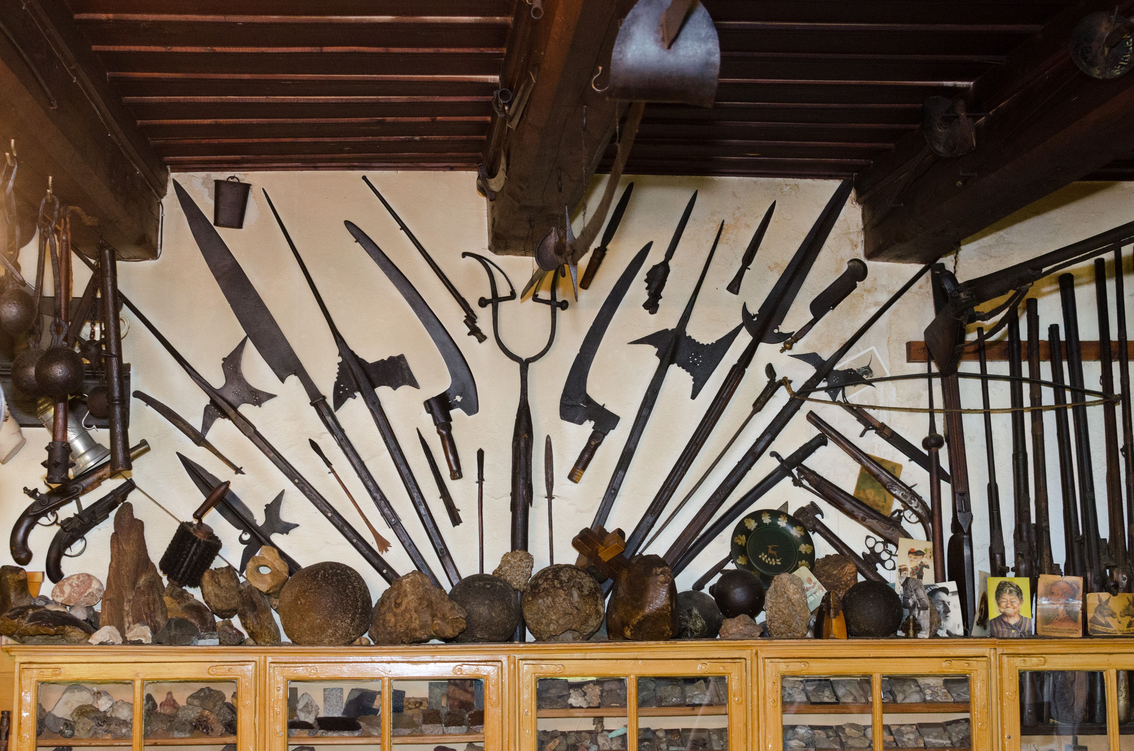 Wall with historical weapons and artifacts in the local history museum.
