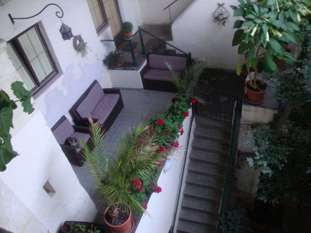 Inner courtyard with seating area and plants.