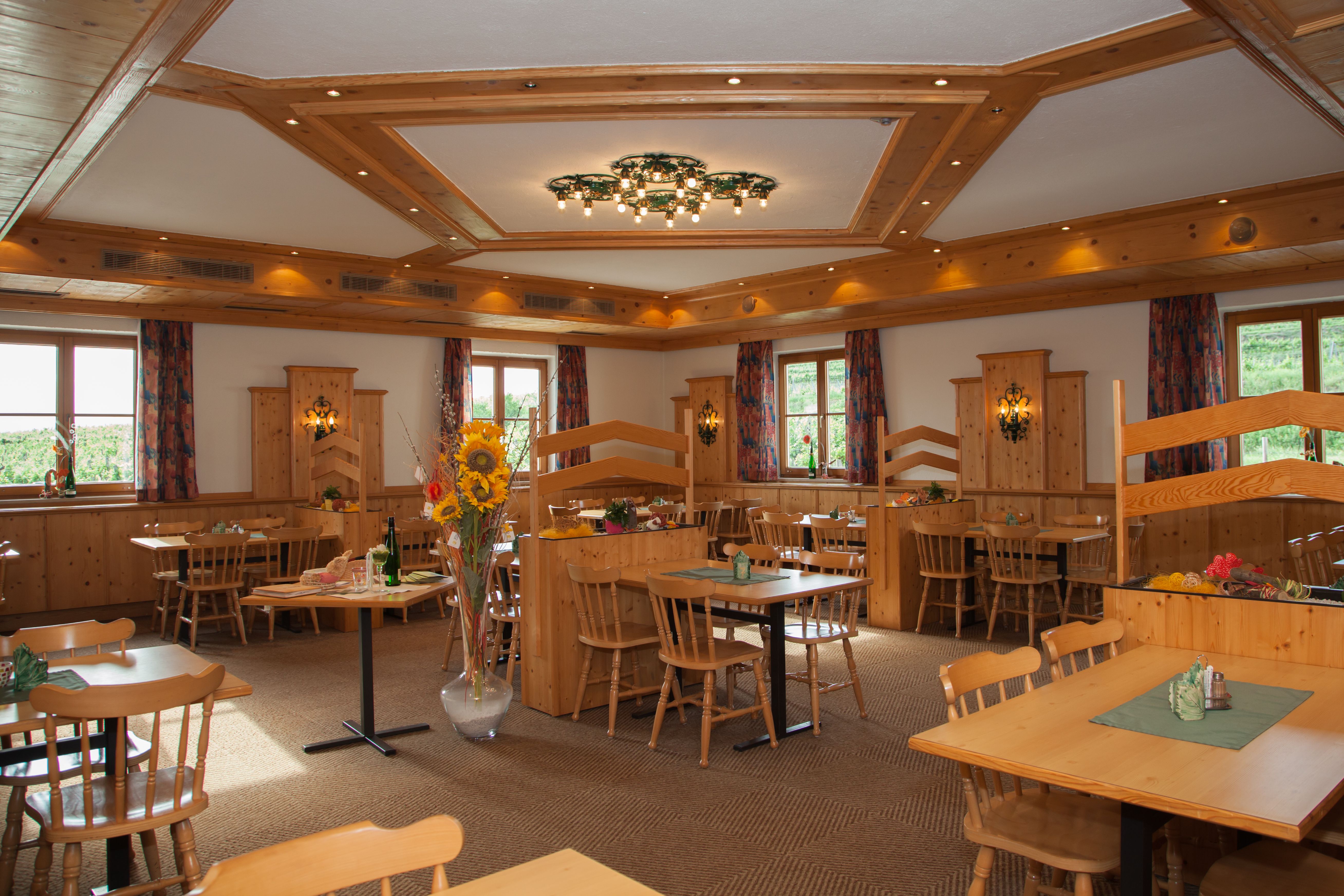 Cozy dining room with wooden furniture and decorations.