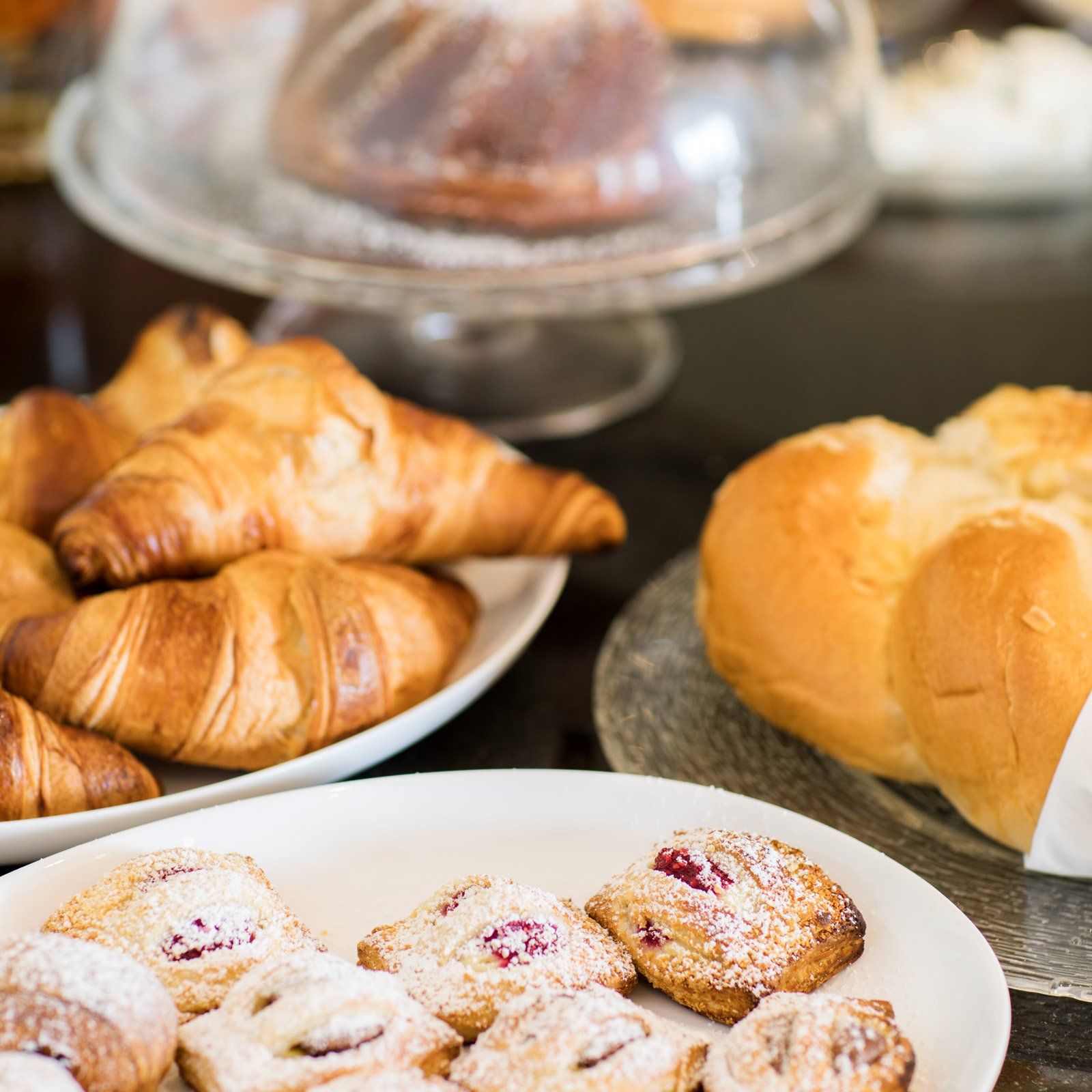 A richly laid breakfast table with pastries and Danish pastries 
