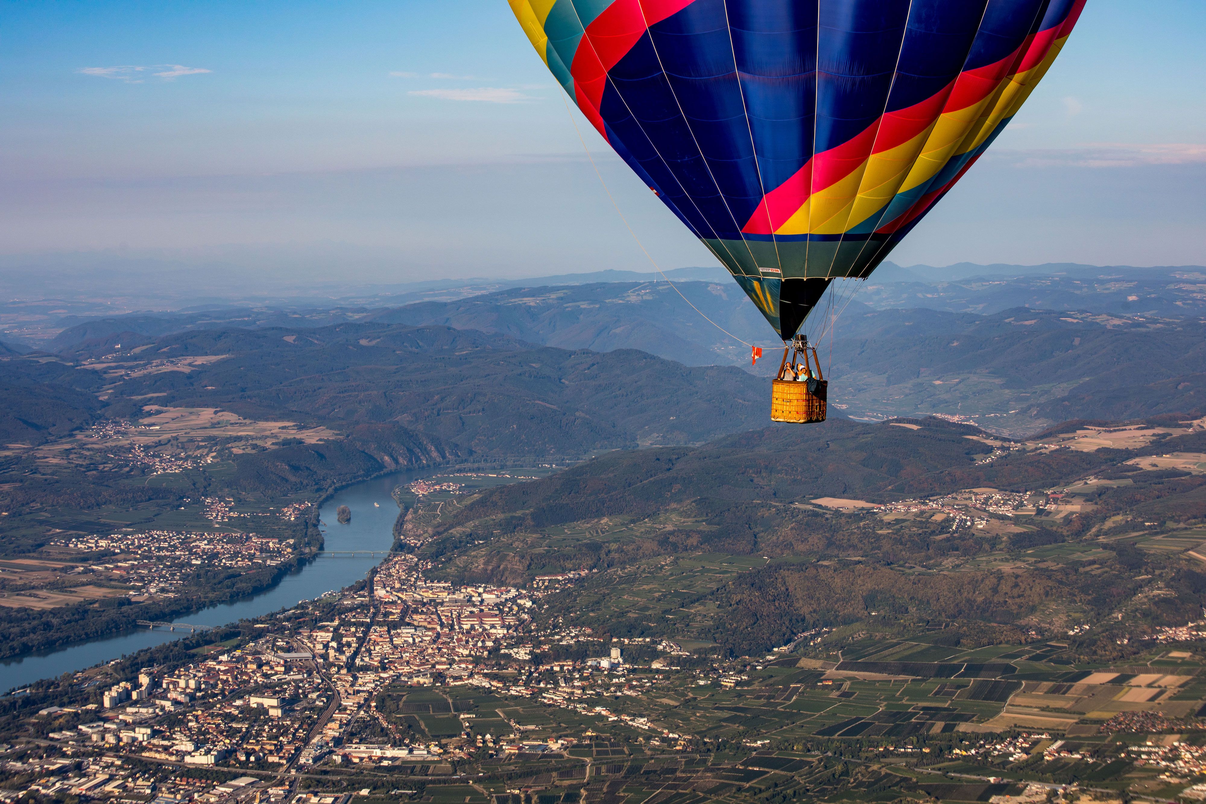 Hot air balloon over the Wachau with a view of the Danube and surrounding countryside.