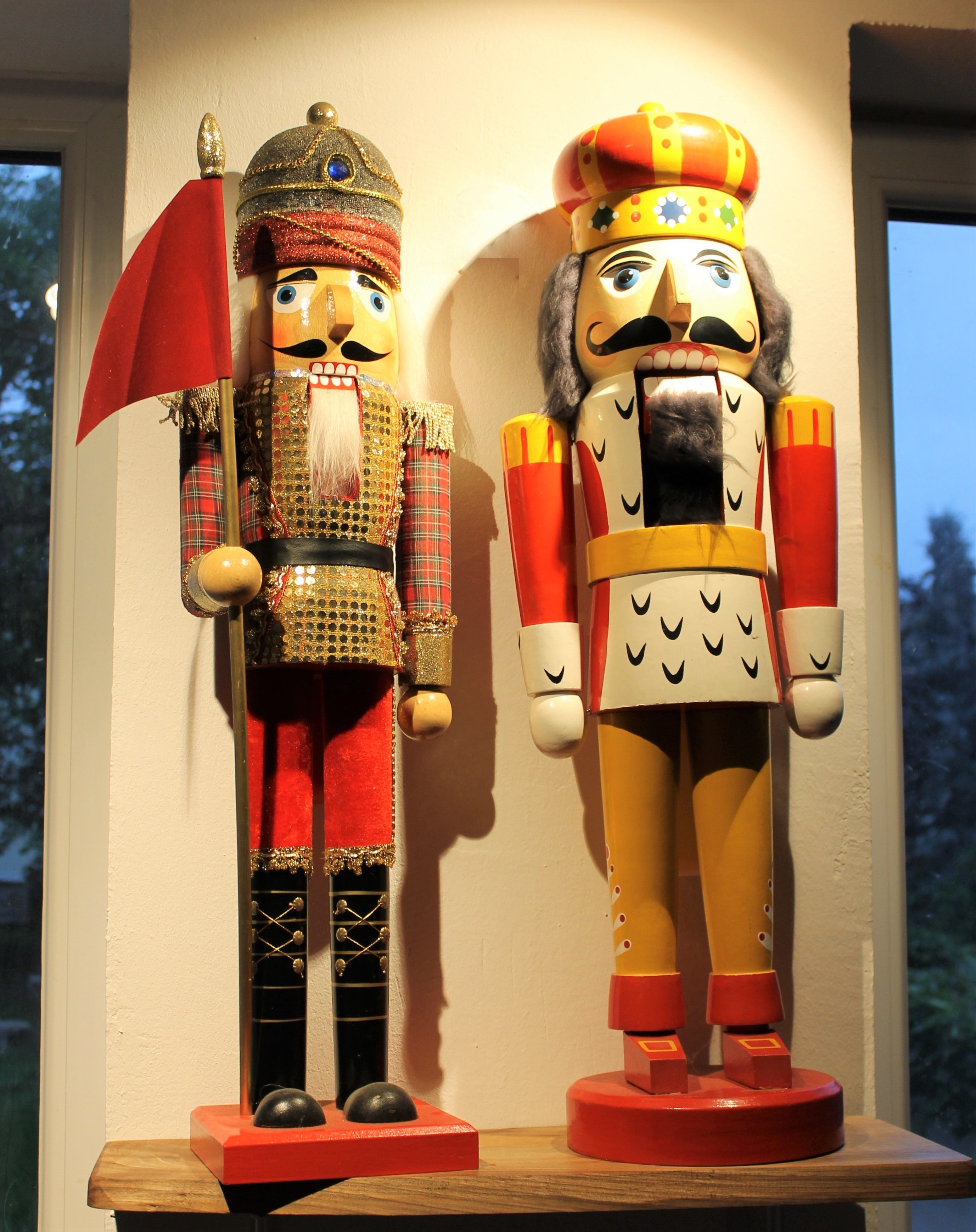 Two large, decorative nutcracker figures in one room.