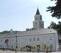 Church with tower and adjoining building in St. Andrä-Wördern.