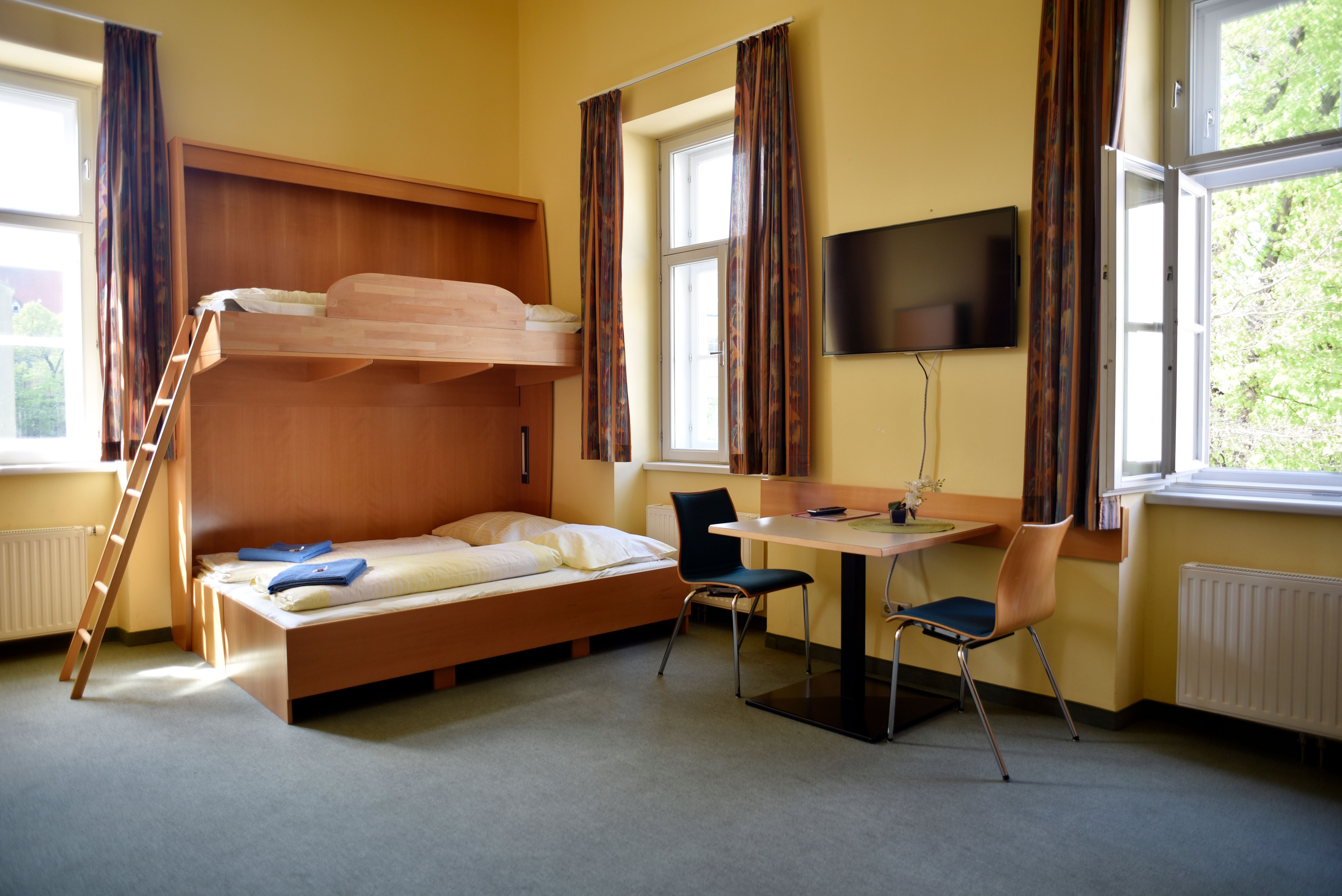 Double room that can be converted into a multi-bed room with a wall bed 