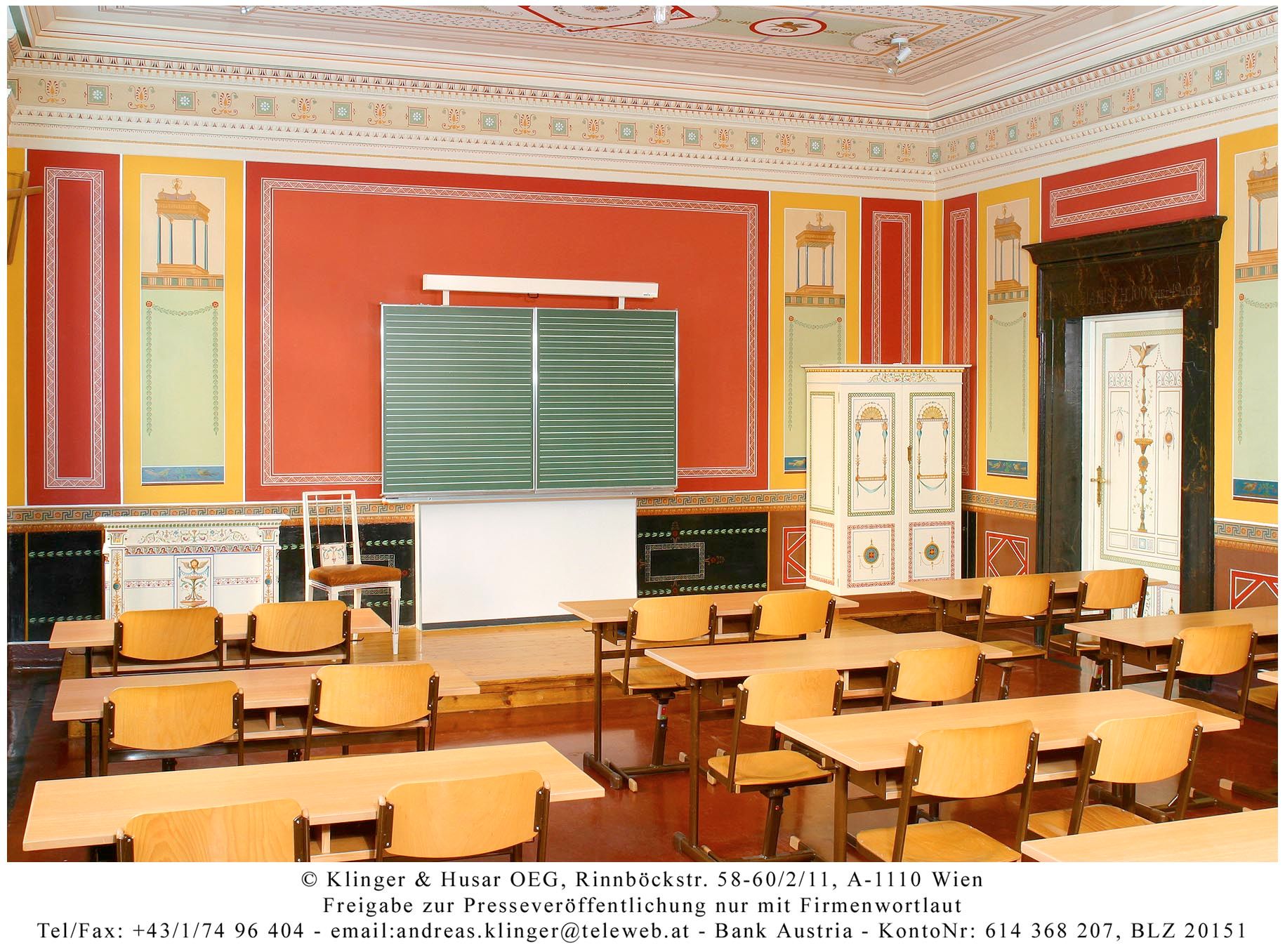 Classroom in Berndorf style with antique decor and wooden furniture.