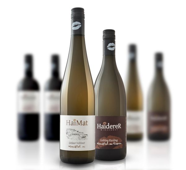 Two wine bottles in the foreground, blurred bottles in the background.