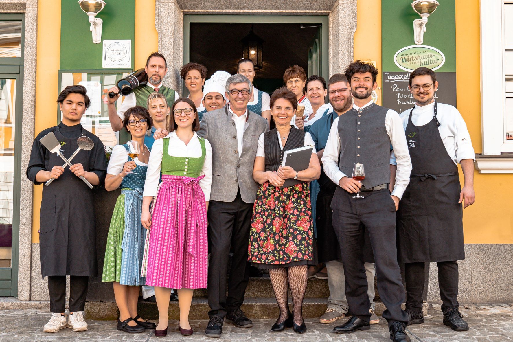 The team of the Hotel Zur Post in Melk in front of the restaurant.