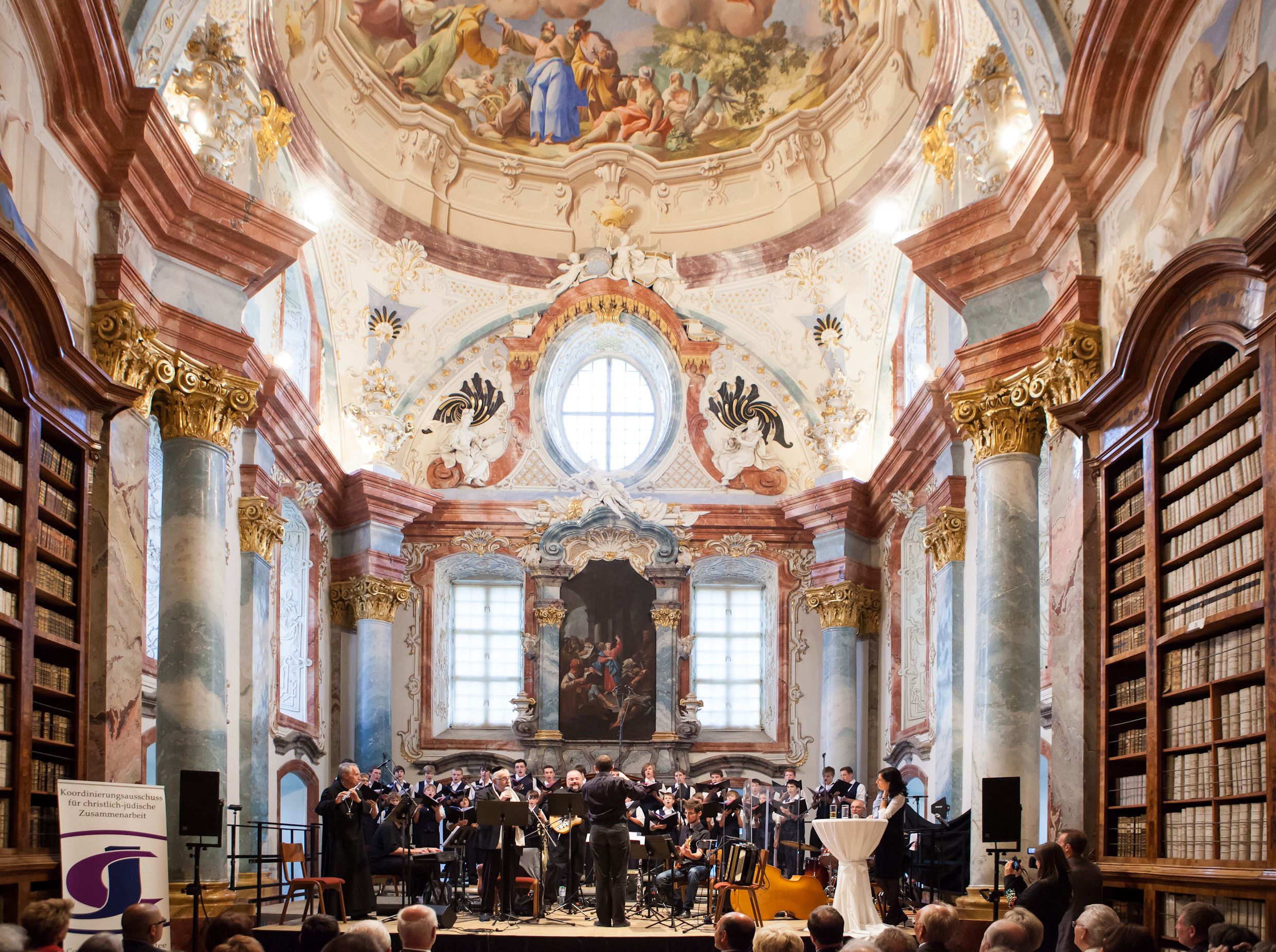 Concert in the baroque library of Altenburg Abbey with orchestra and choir.