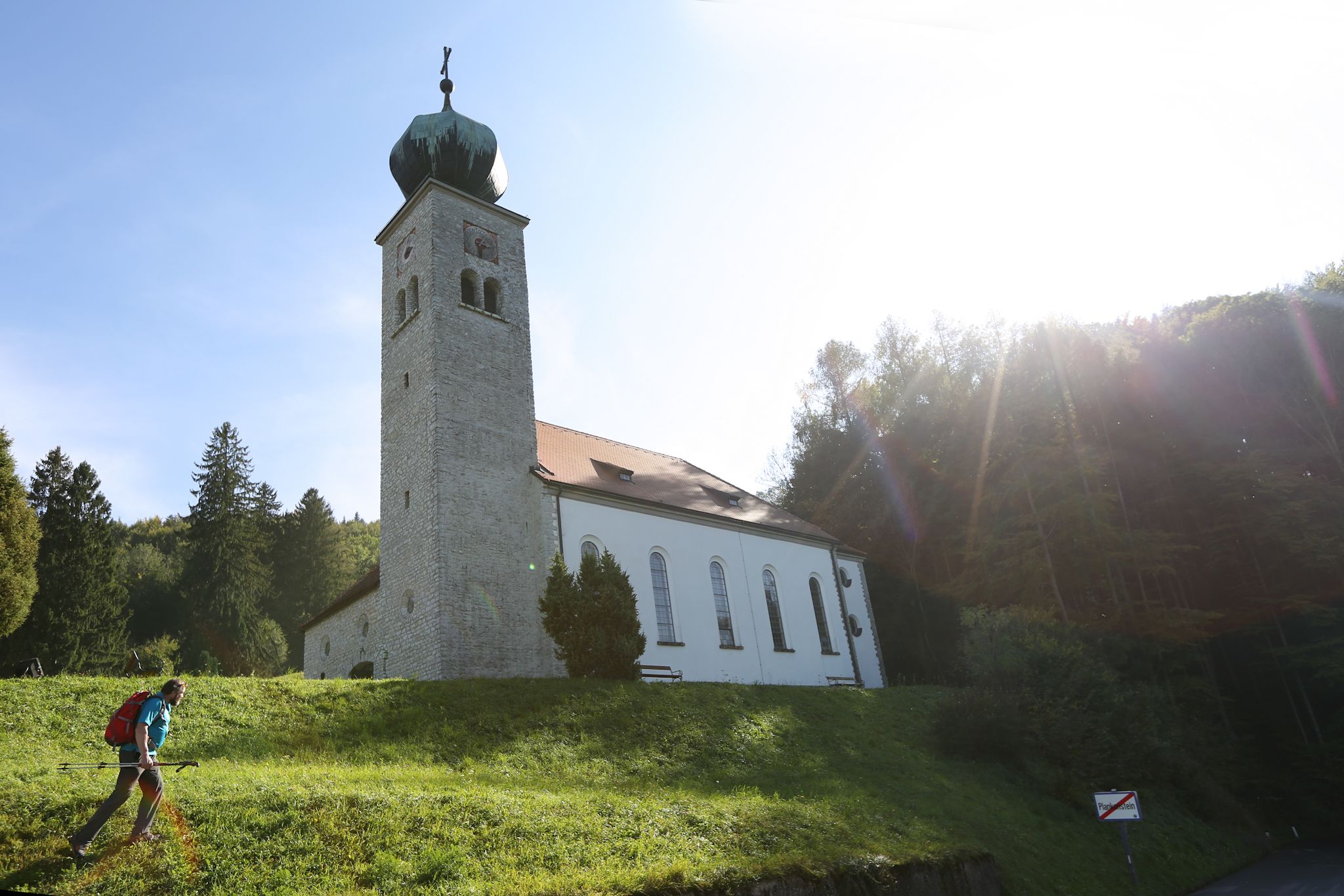 Maria Schnee pilgrimage church with hiker in the foreground.