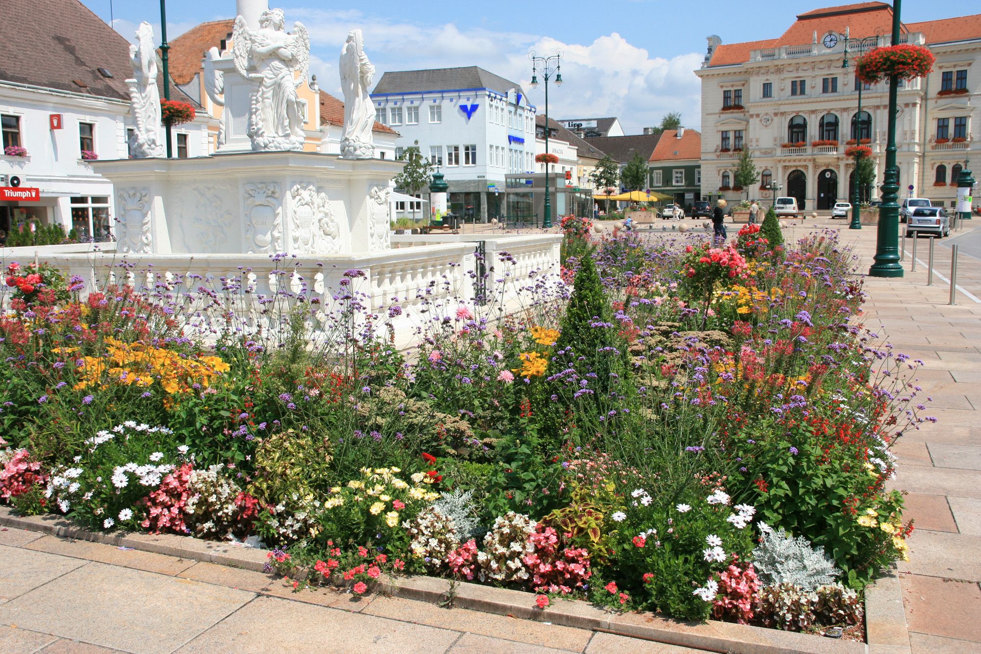 Flower bed in front of the plague column on the main square in Tulln.