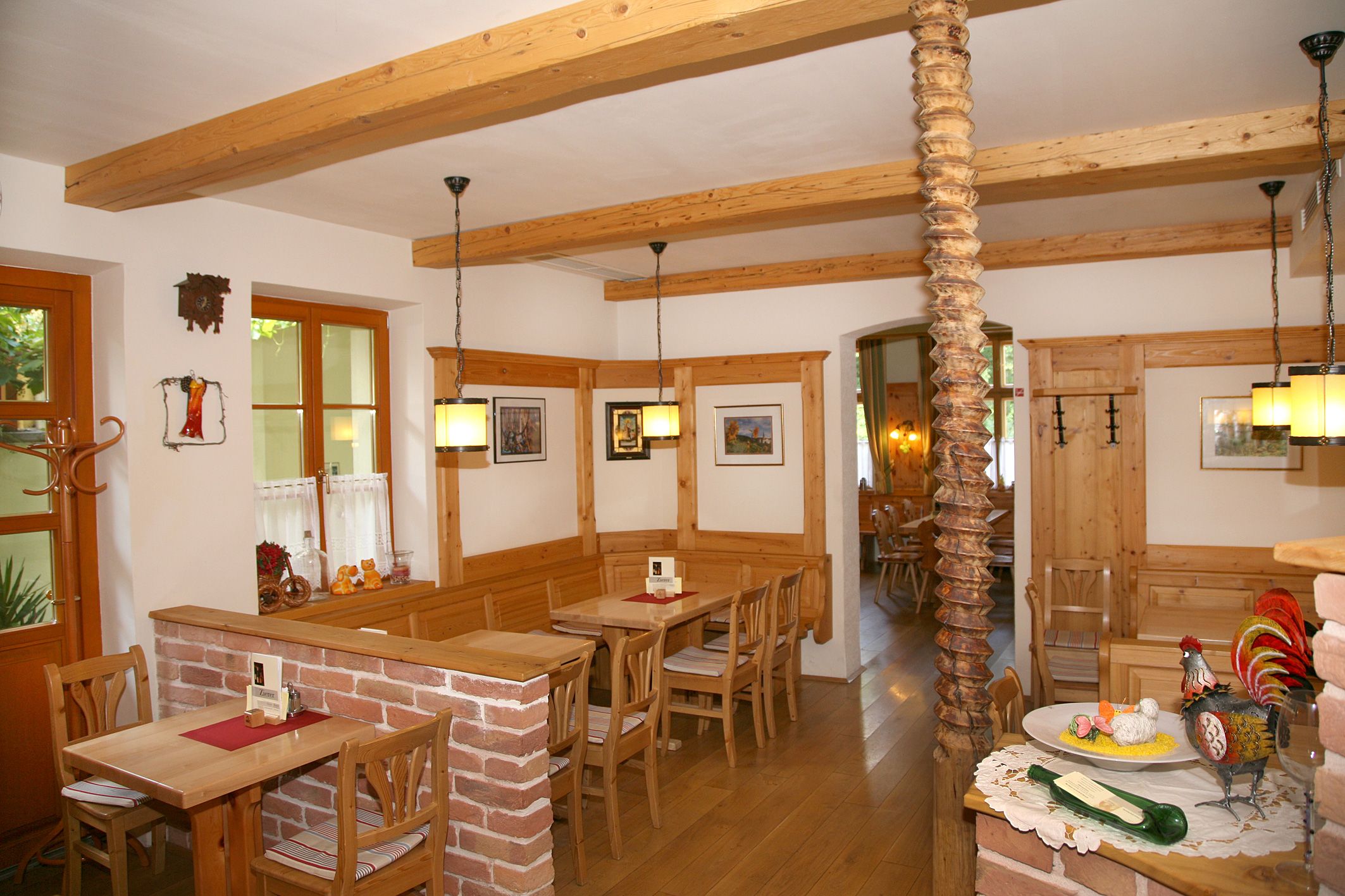 Cozy dining room with wooden furniture and decorations.