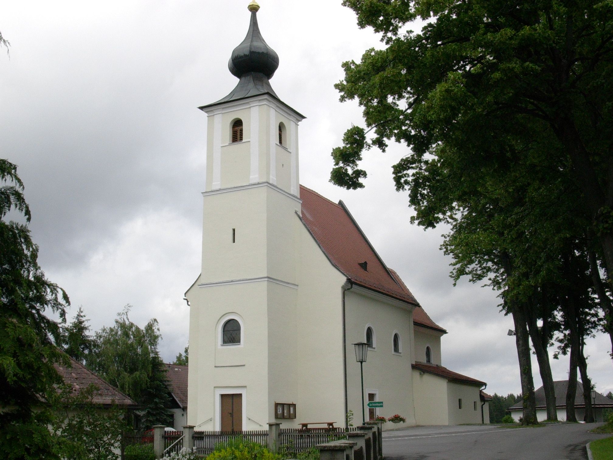 St. Mary's pilgrimage church with onion dome and cloudy sky.