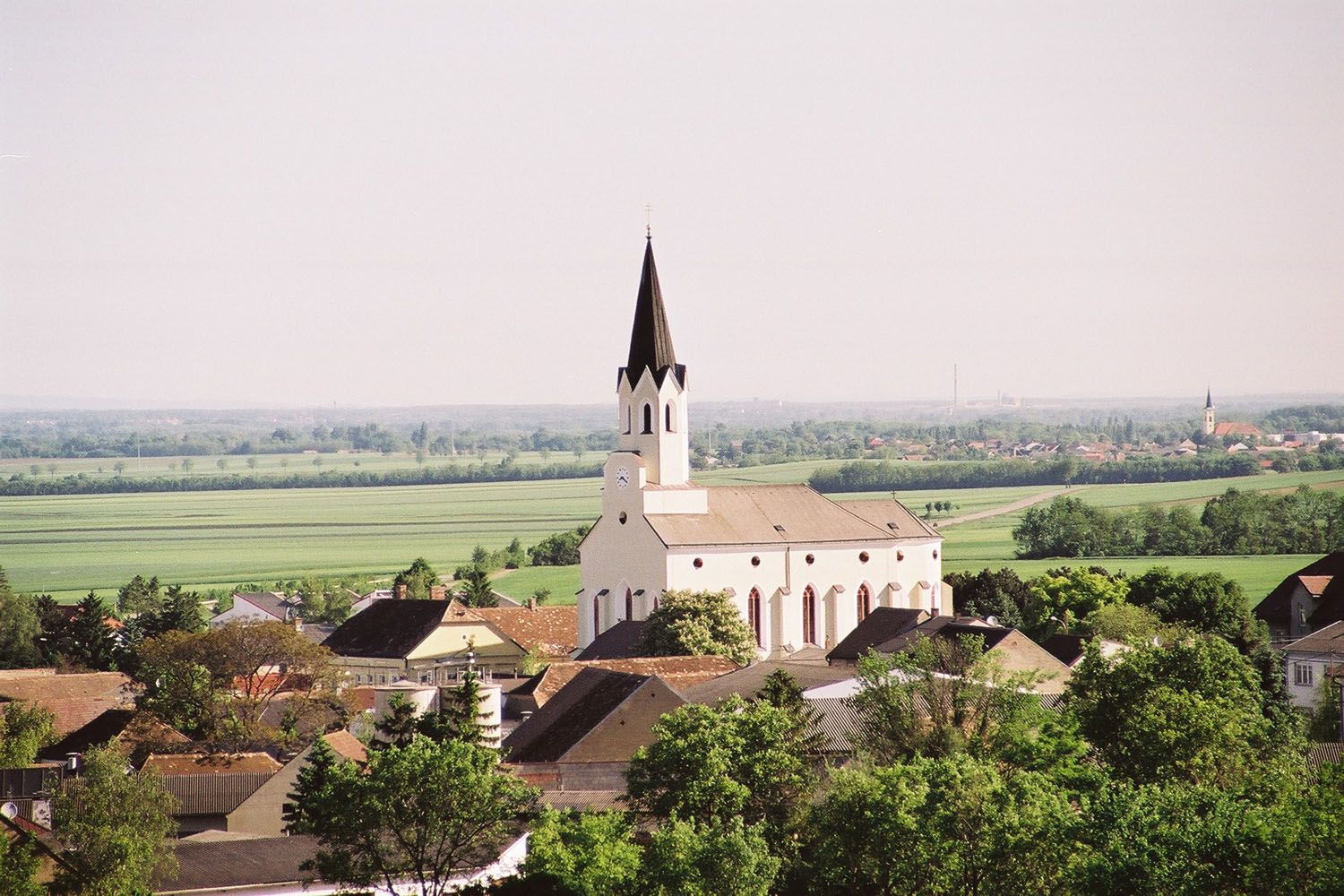 Landscape with church and village in Unterstinkenbrunn.