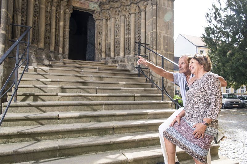 Karner entrance portal with people in front of it 